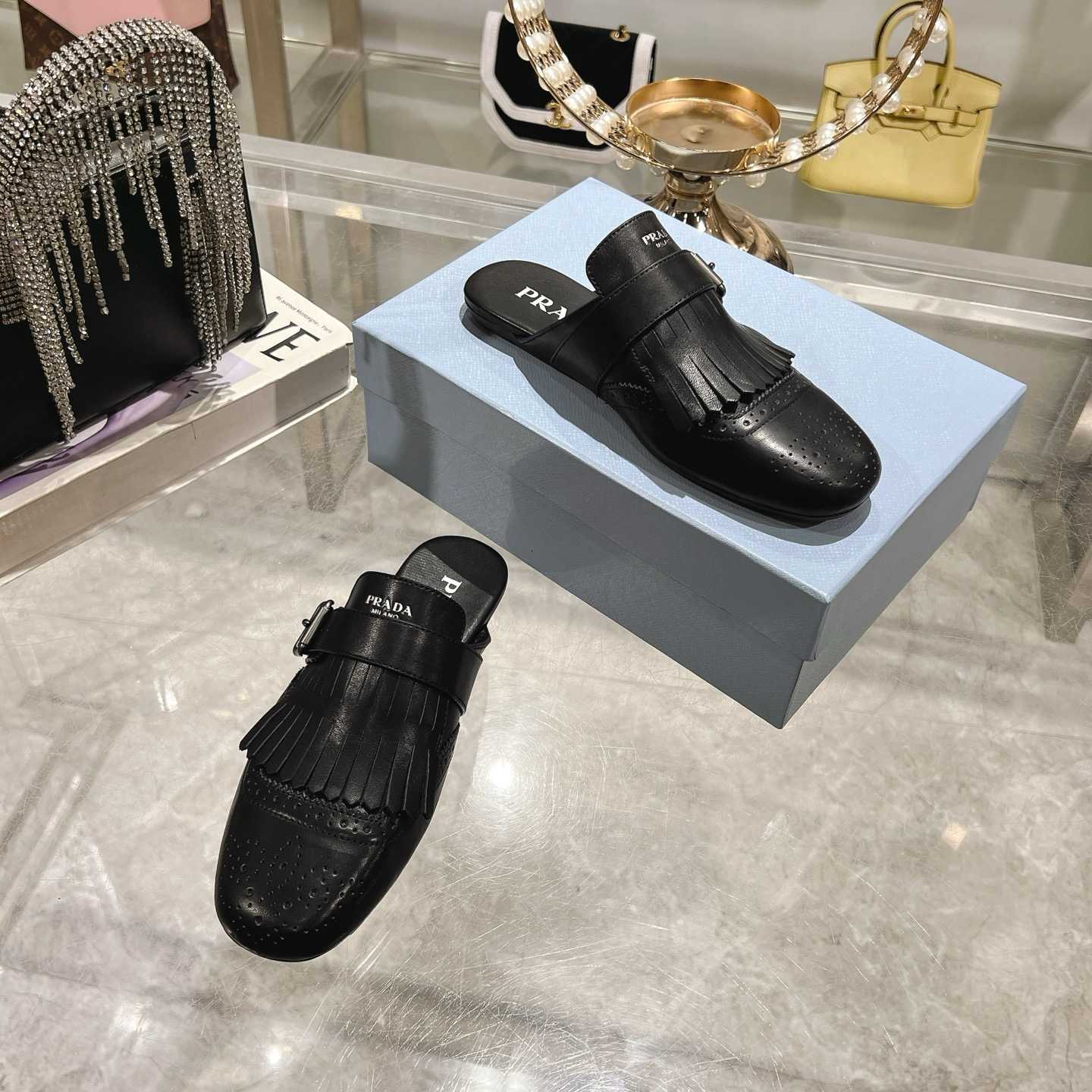 Prada Shuffle Fringed Monk Strap Leather Mules - FashionPlug