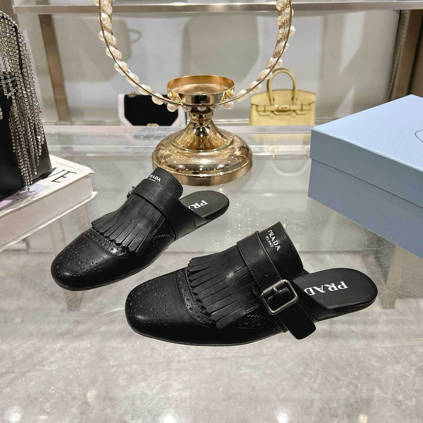 Prada Shuffle Fringed Monk Strap Leather Mules - FashionPlug