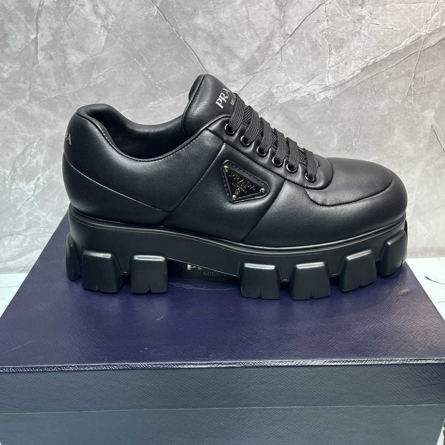 Prada Padded Nappa Leather Lace-up Shoes - FashionPlug