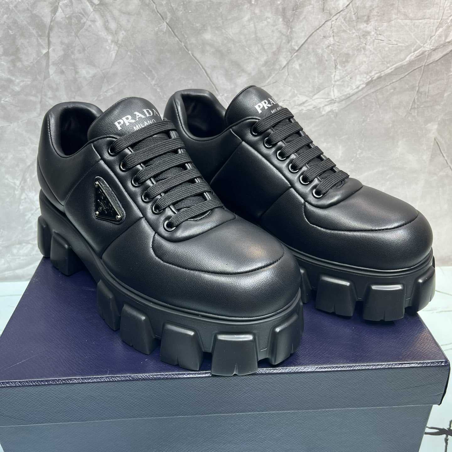 Prada Padded Nappa Leather Lace-up Shoes - FashionPlug
