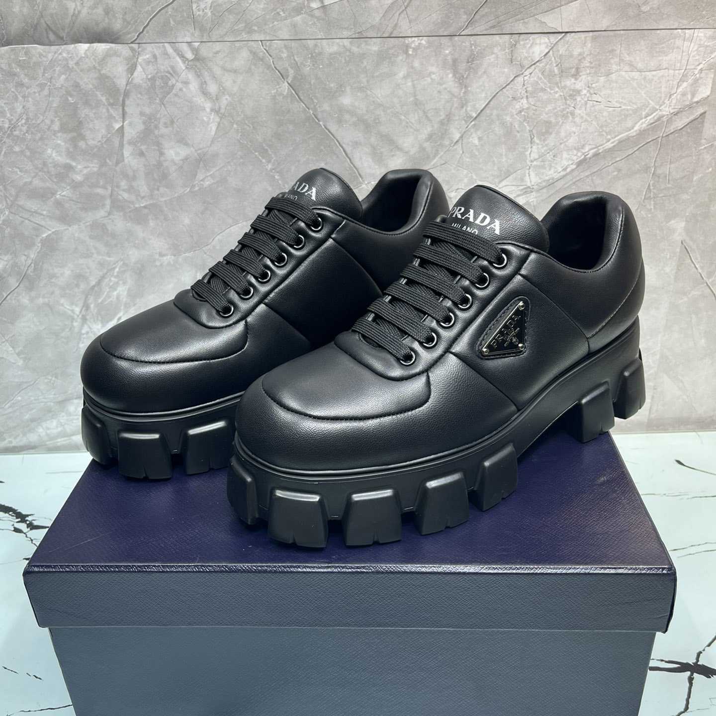 Prada Padded Nappa Leather Lace-up Shoes - FashionPlug