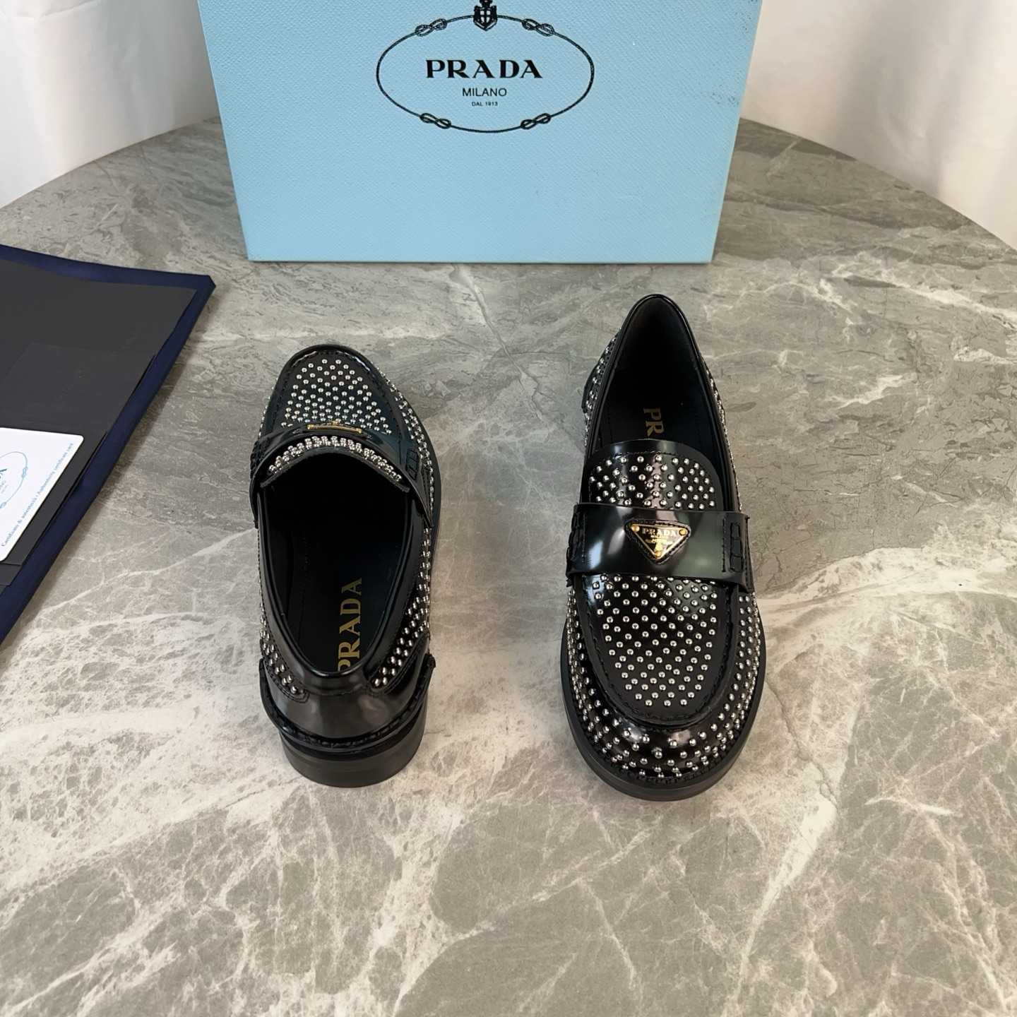 Prada Studded Brushed Leather Loafers - FashionPlug