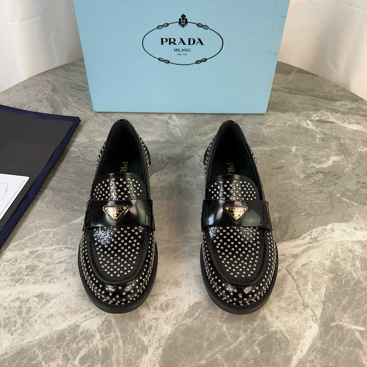 Prada Studded Brushed Leather Loafers - FashionPlug