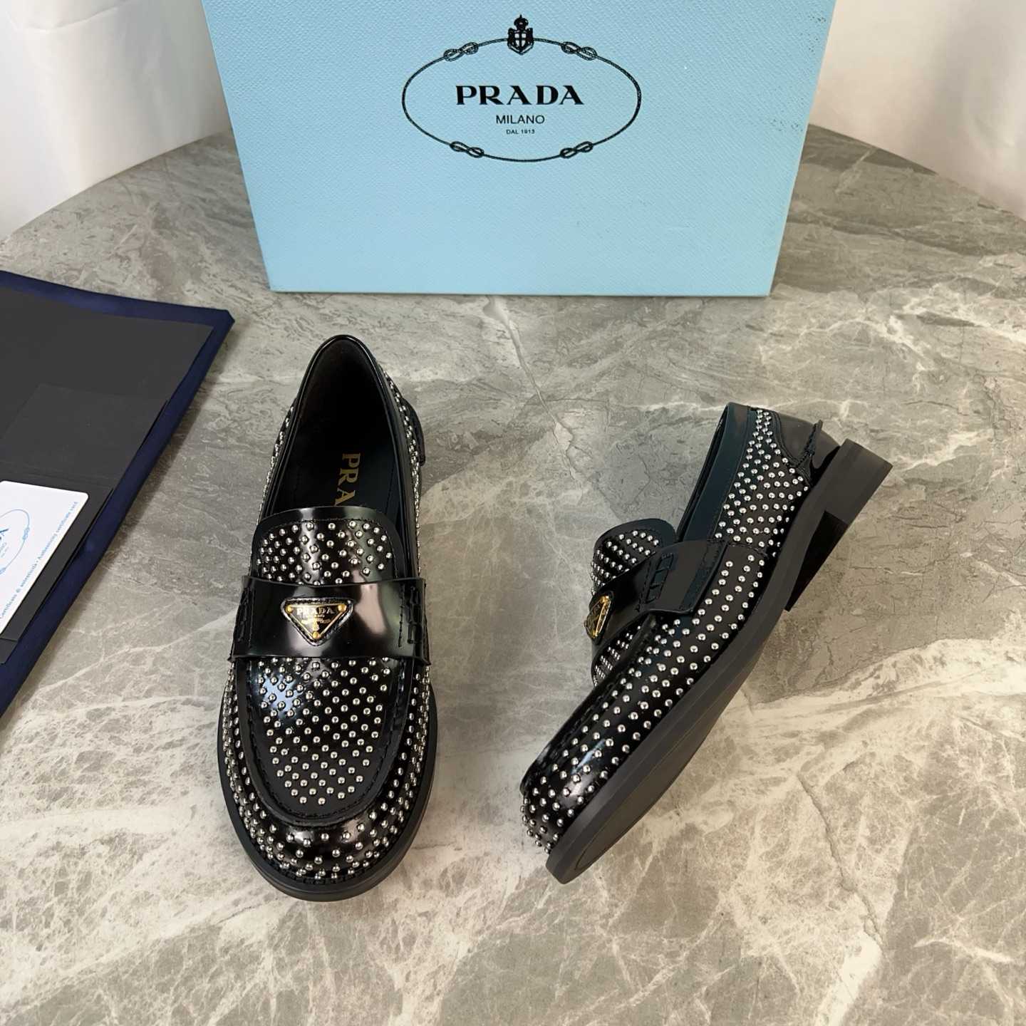 Prada Studded Brushed Leather Loafers - FashionPlug