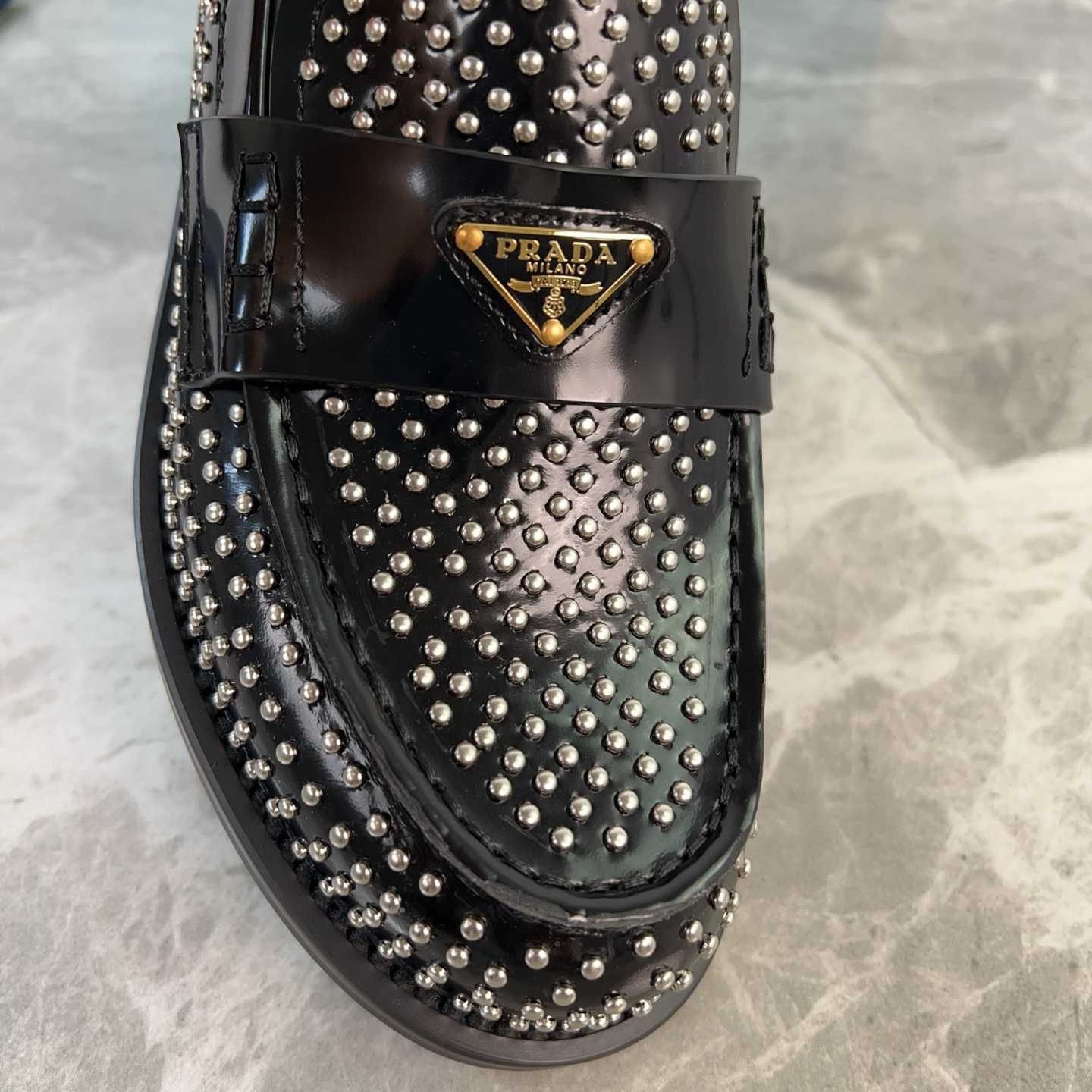 Prada Studded Brushed Leather Loafers - FashionPlug