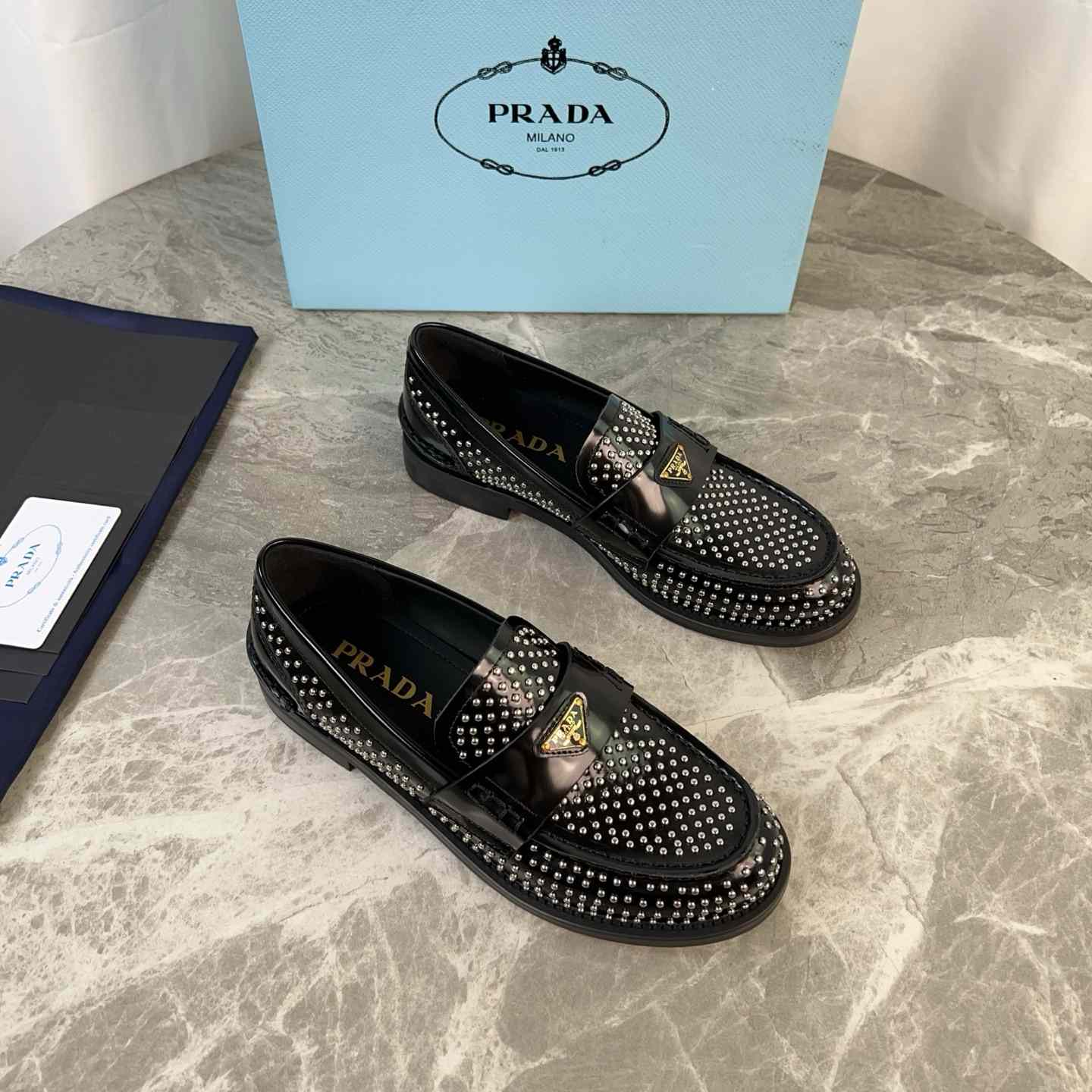 Prada Studded Brushed Leather Loafers - FashionPlug