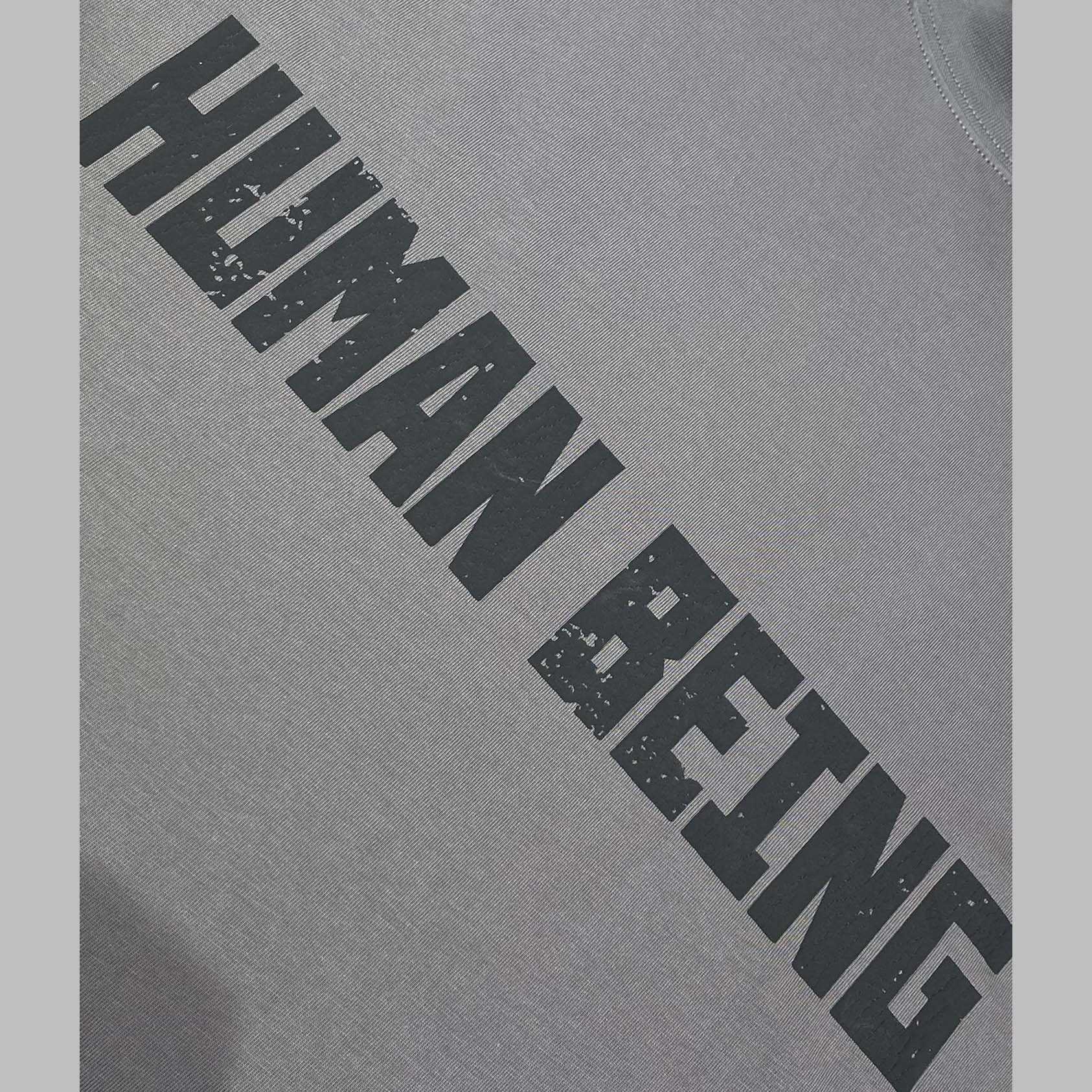 Balenciaga Human Being Shifted T-Shirt In Dark Grey - FashionPlug
