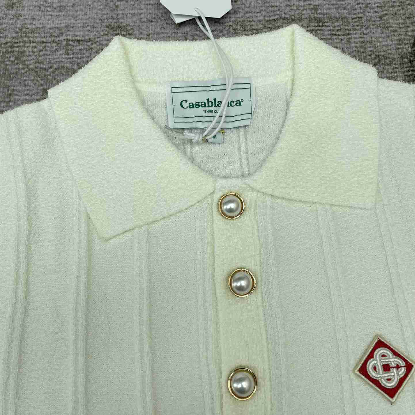 Casablanca Logo Appliqué Boucle Polo Shirt   D0016 - FashionPlug
