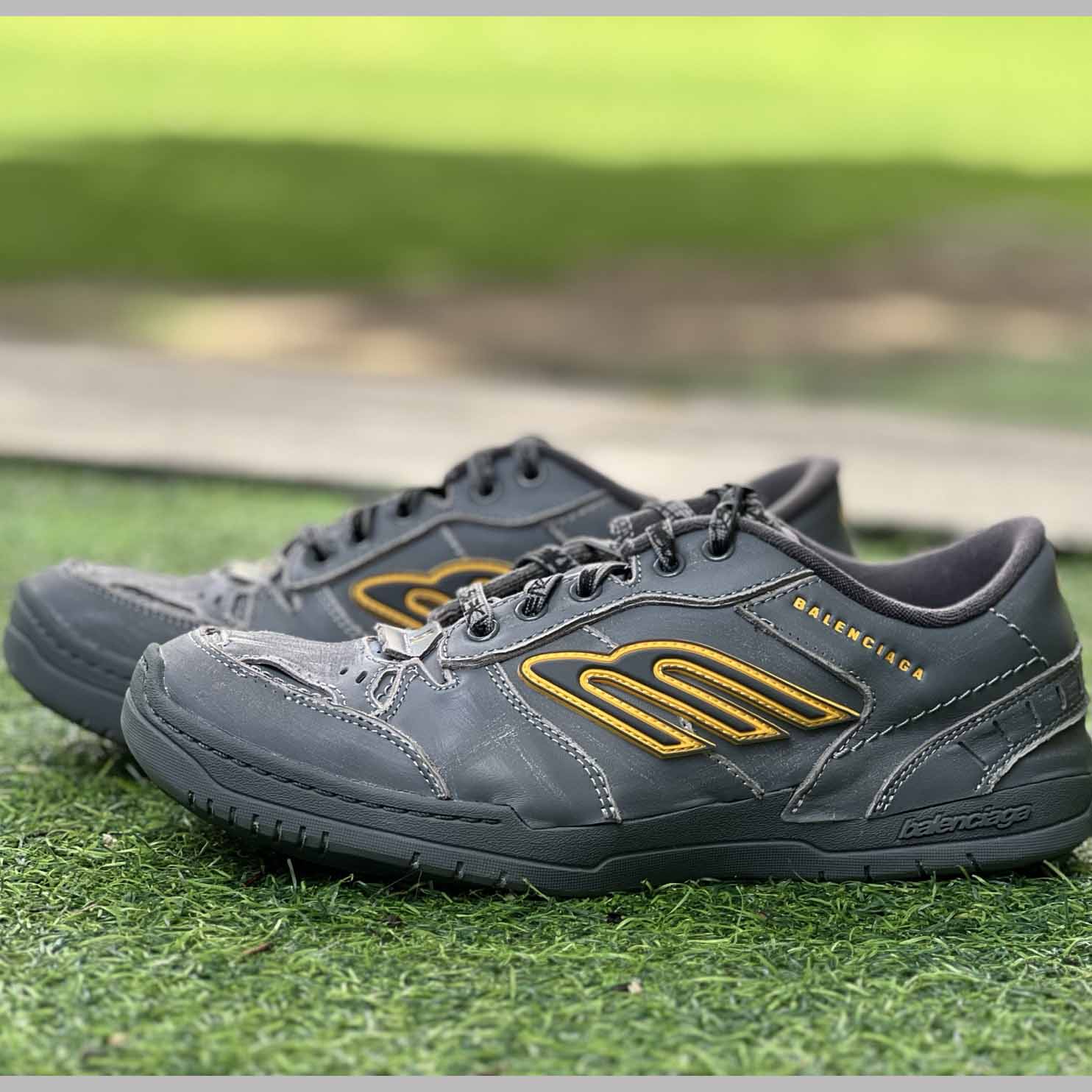 Balenciaga Hamptons Worn-Out Sneaker In Grey And Yellow Cowskin And Polyester - FashionPlug