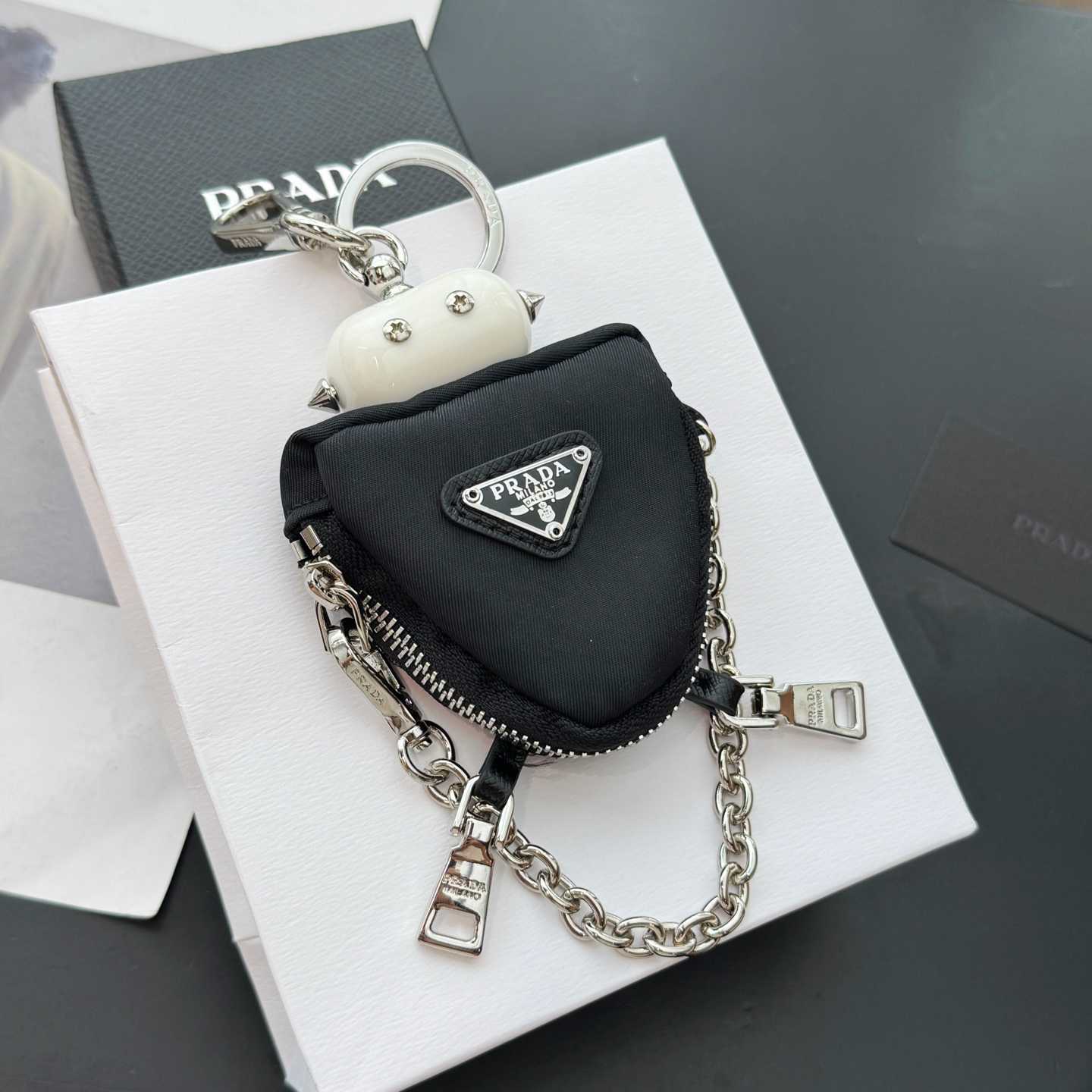 Prada Robot Trick Keychain - FashionPlug