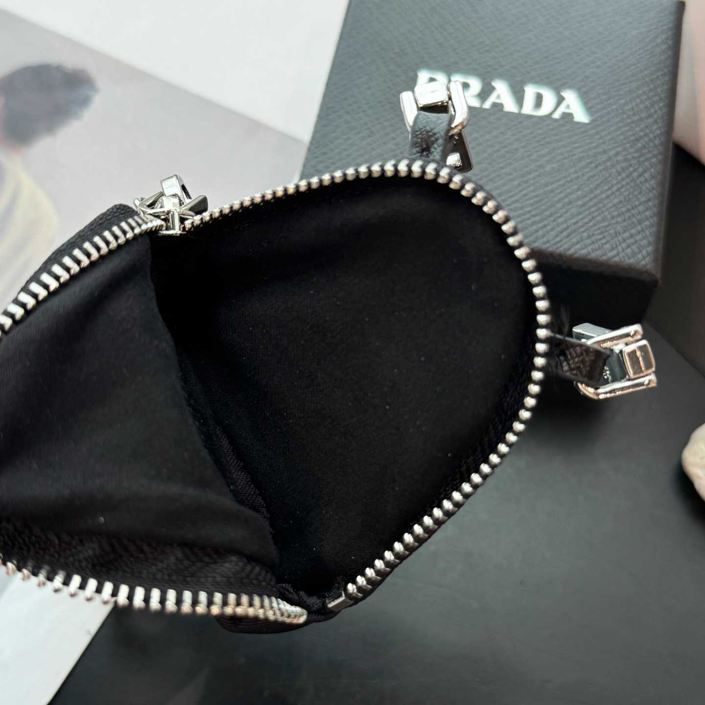 Prada Robot Trick Keychain - FashionPlug