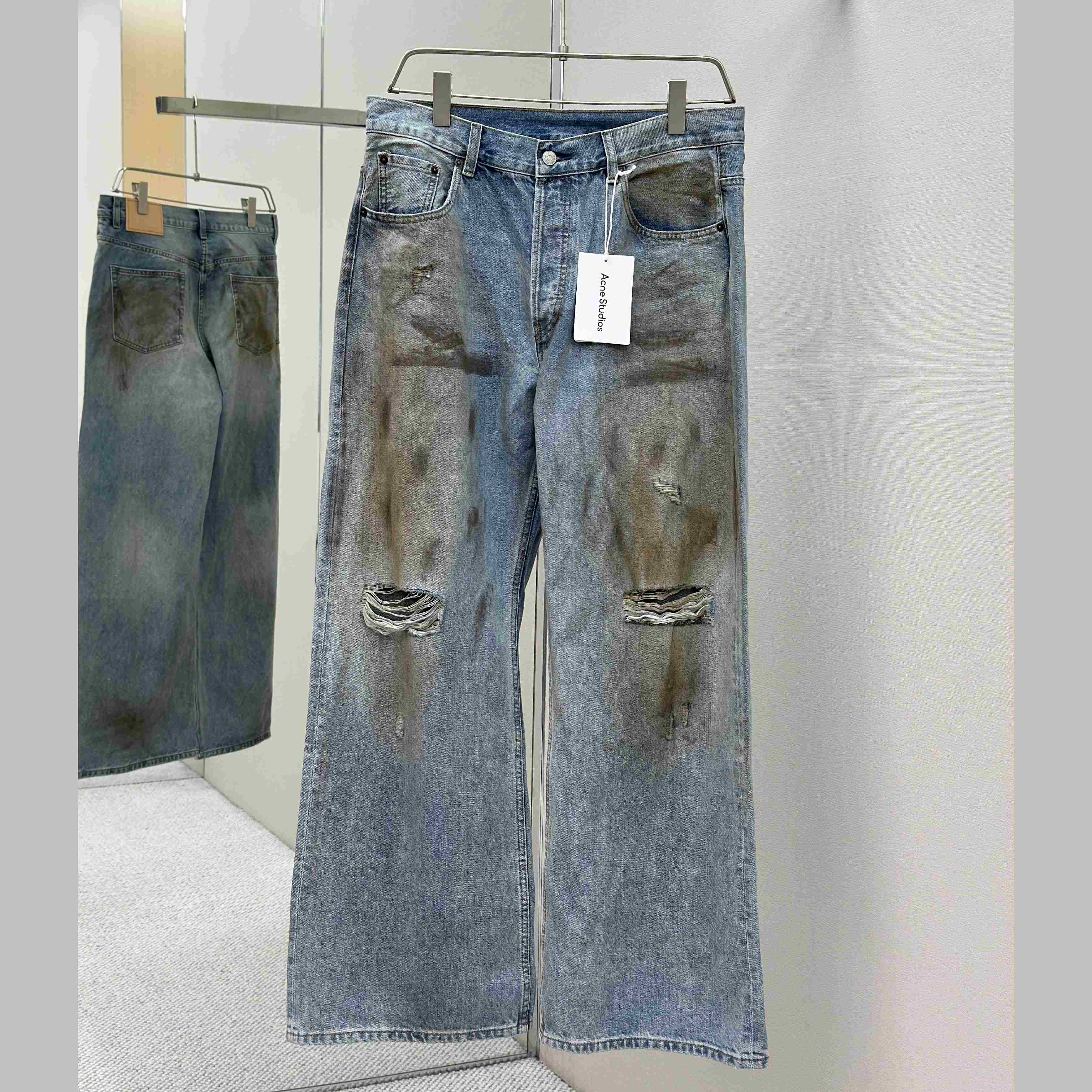Acne Studios Mud-dyed torn jeans - FashionPlug
