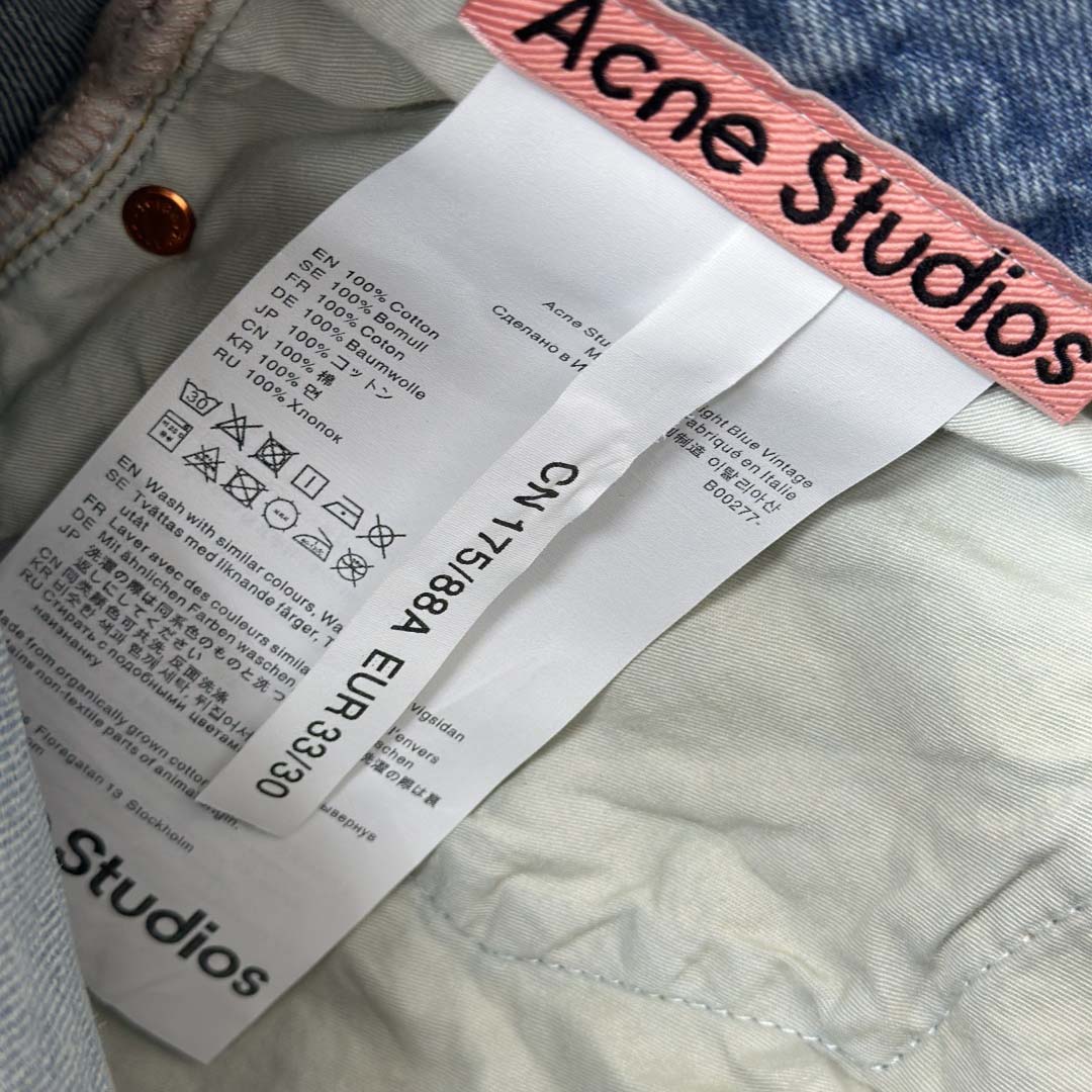 Acne Studios Mud-dyed torn jeans - FashionPlug