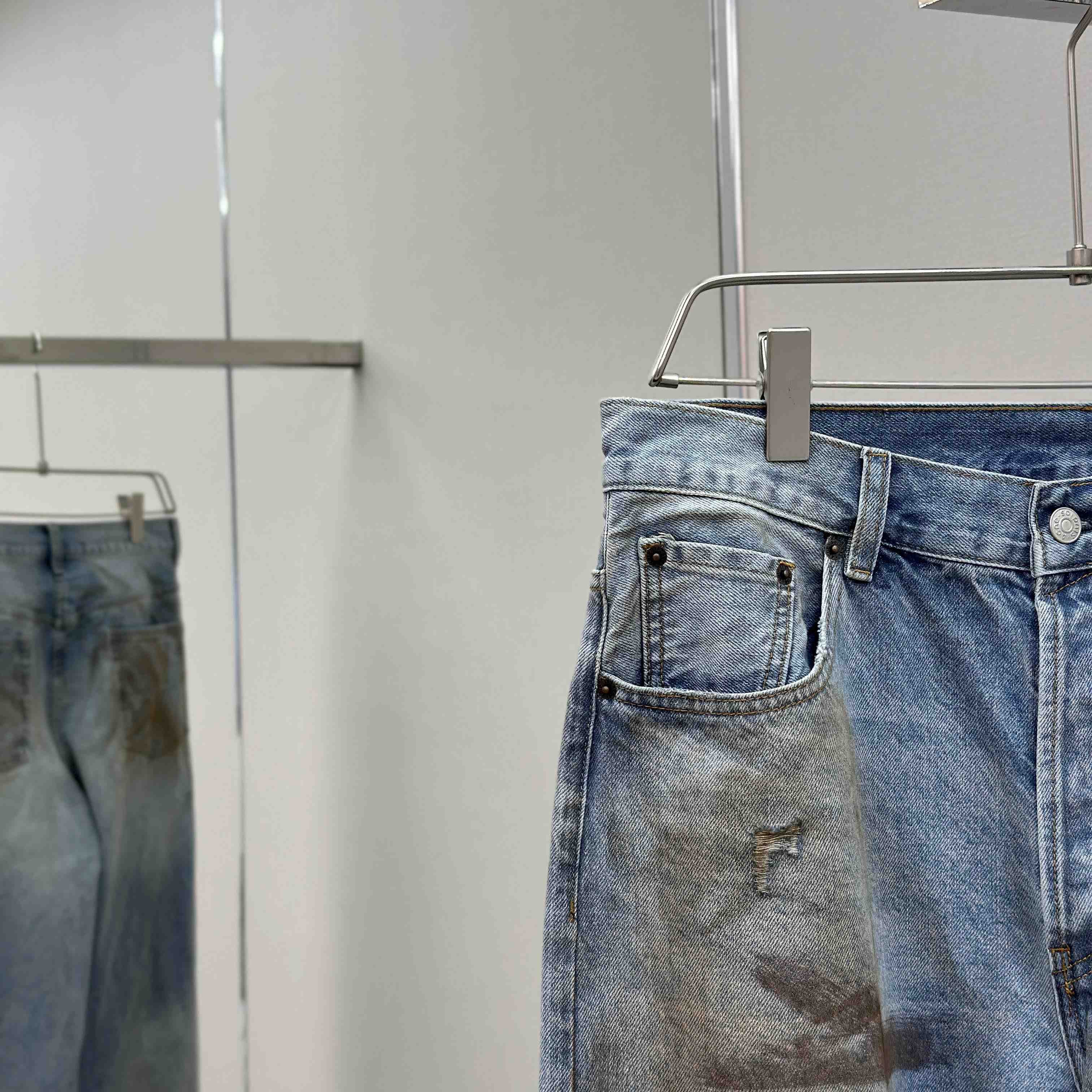Acne Studios Mud-dyed torn jeans - FashionPlug
