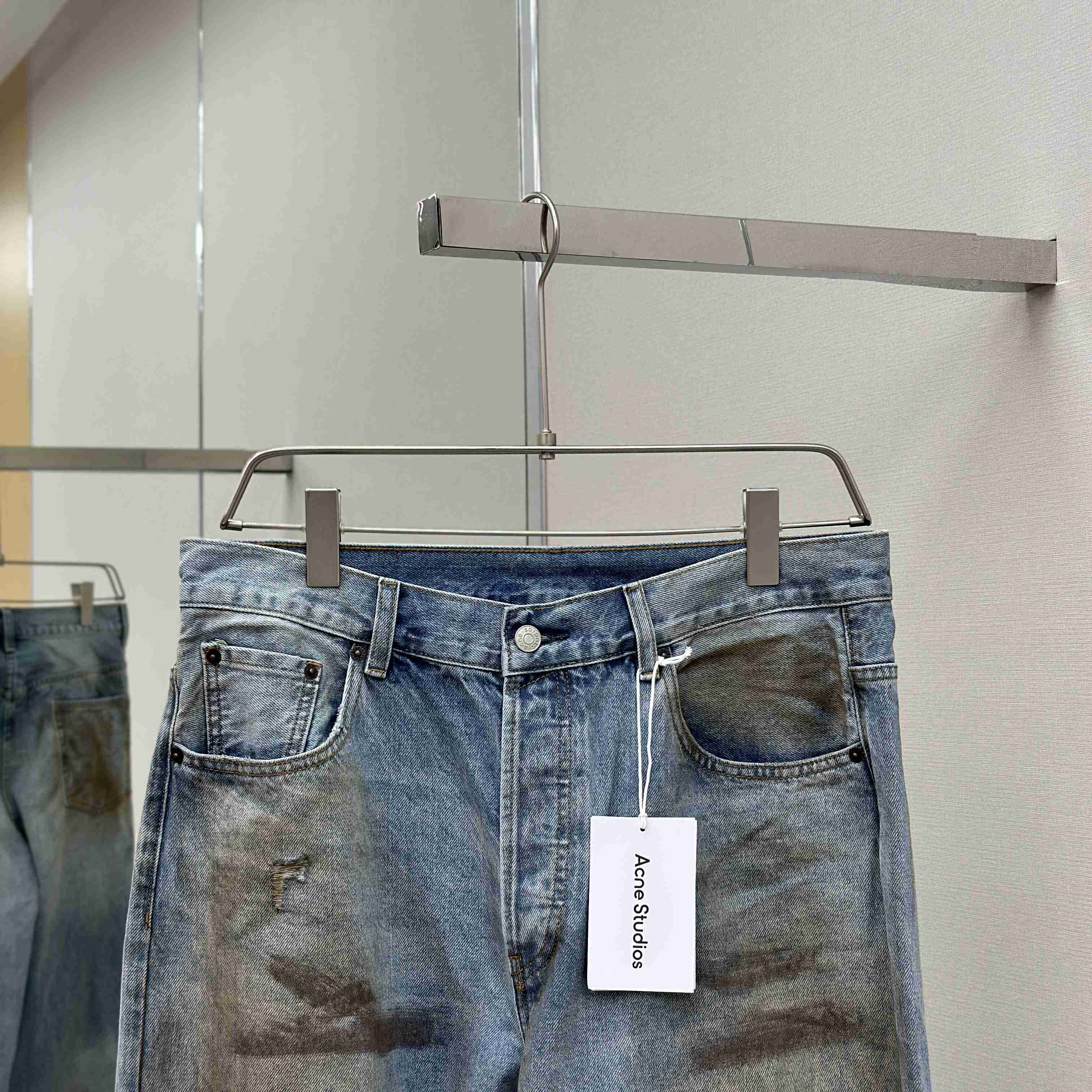Acne Studios Mud-dyed torn jeans - FashionPlug
