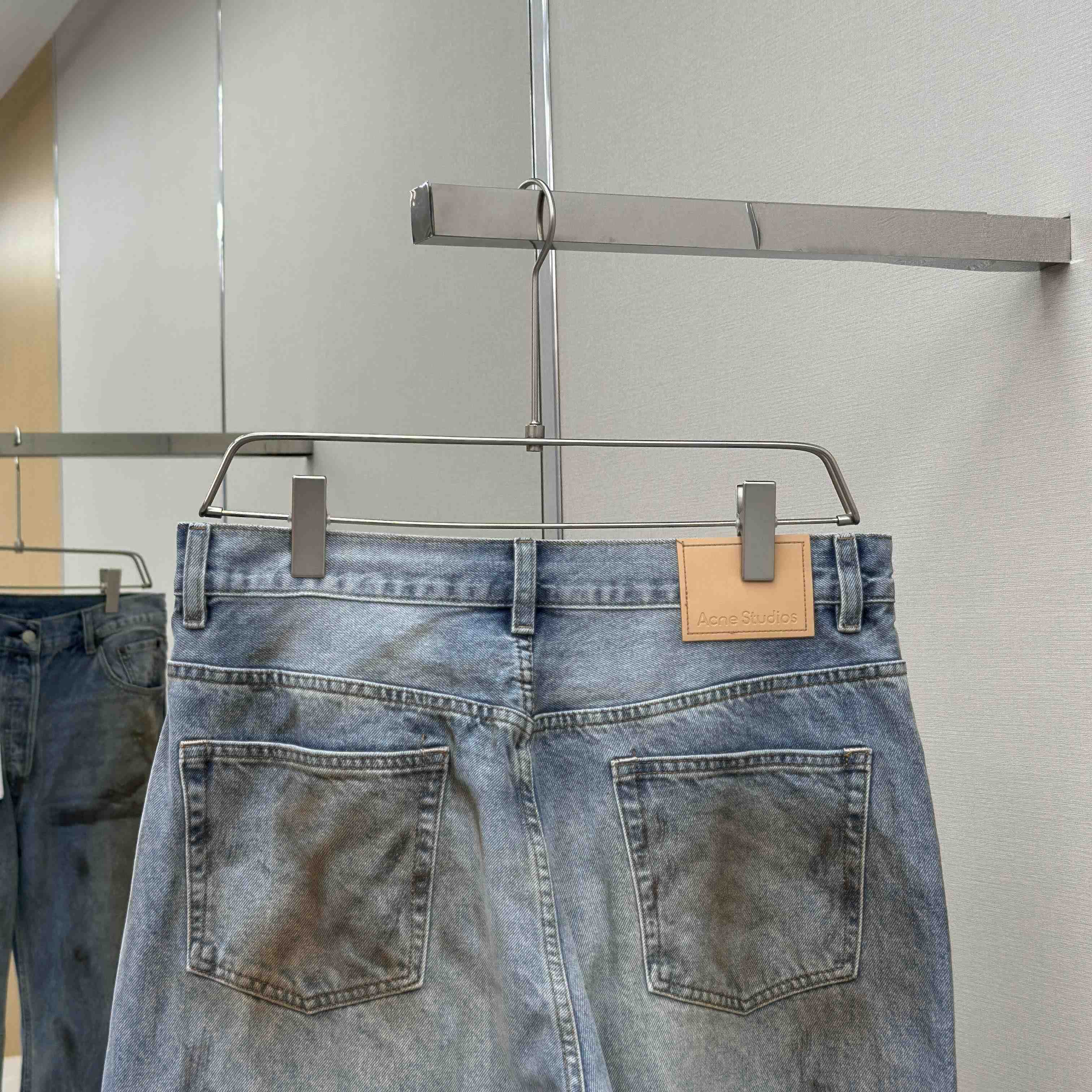 Acne Studios Mud-dyed torn jeans - FashionPlug