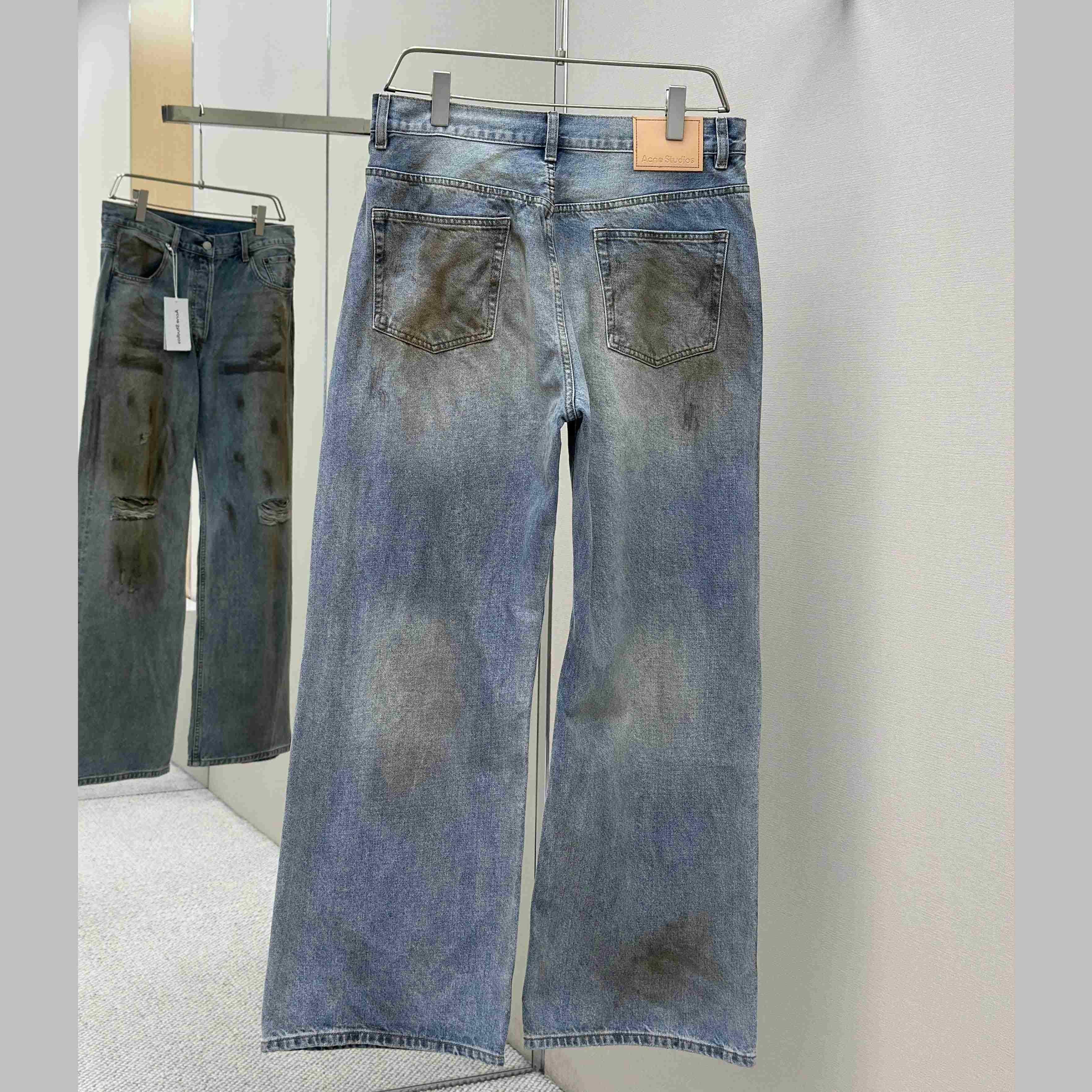 Acne Studios Mud-dyed torn jeans - FashionPlug