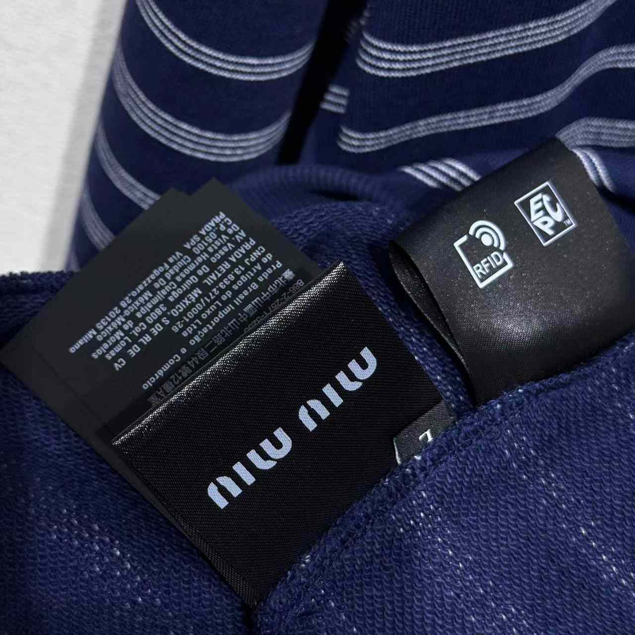 Miu Miu Striped Zipper Polo Shirt - FashionPlug