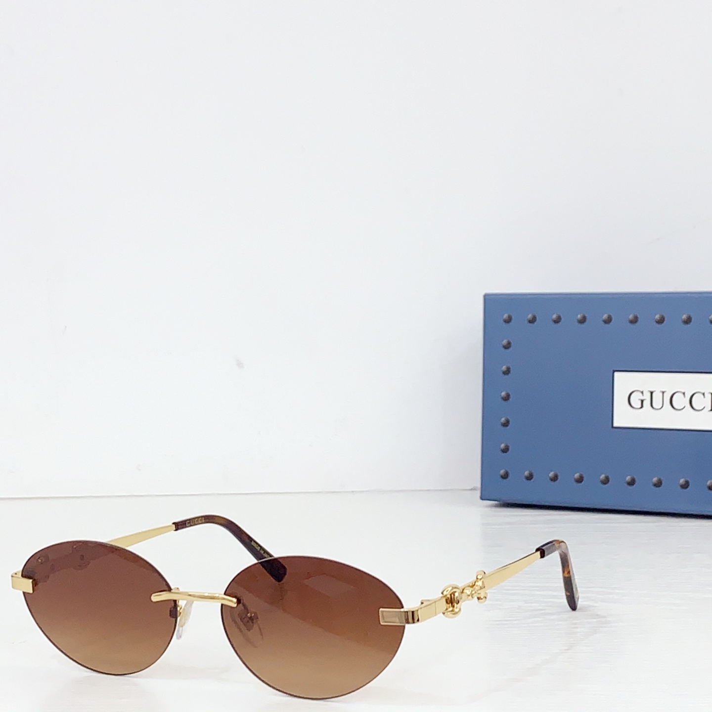 Gucci Frameless Oval Sunglasses - FashionPlug