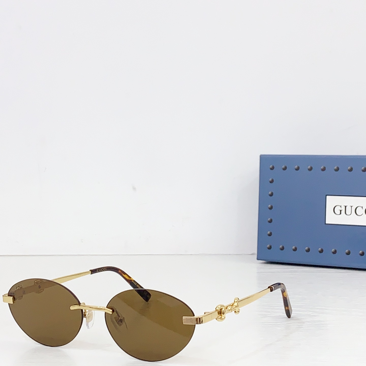 Gucci Frameless Oval Sunglasses - FashionPlug