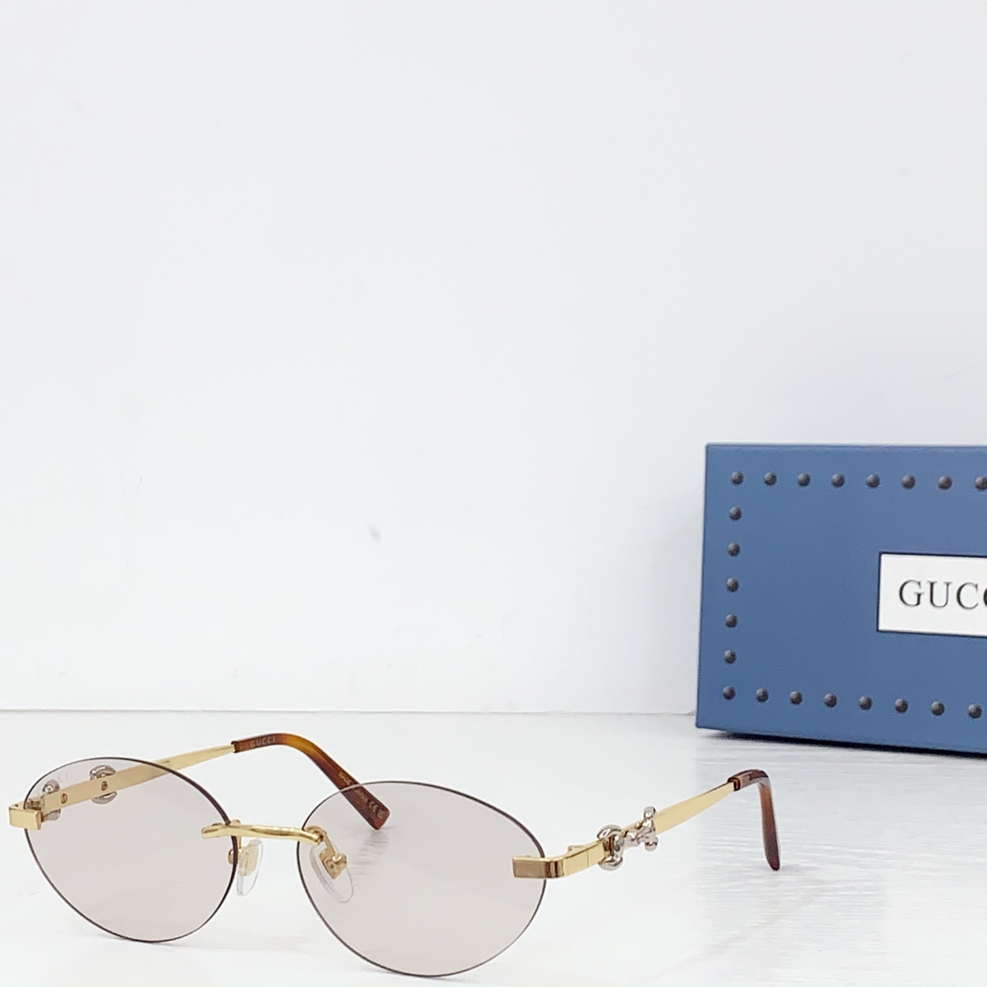 Gucci Frameless Oval Sunglasses - FashionPlug