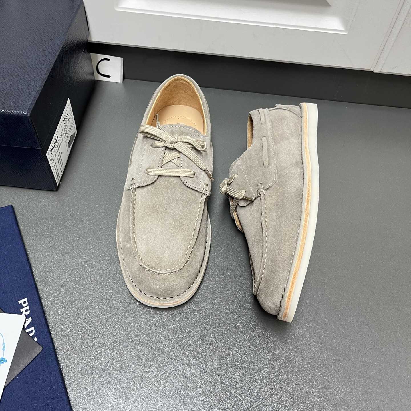 Prada Bleached Suede Loafers - FashionPlug