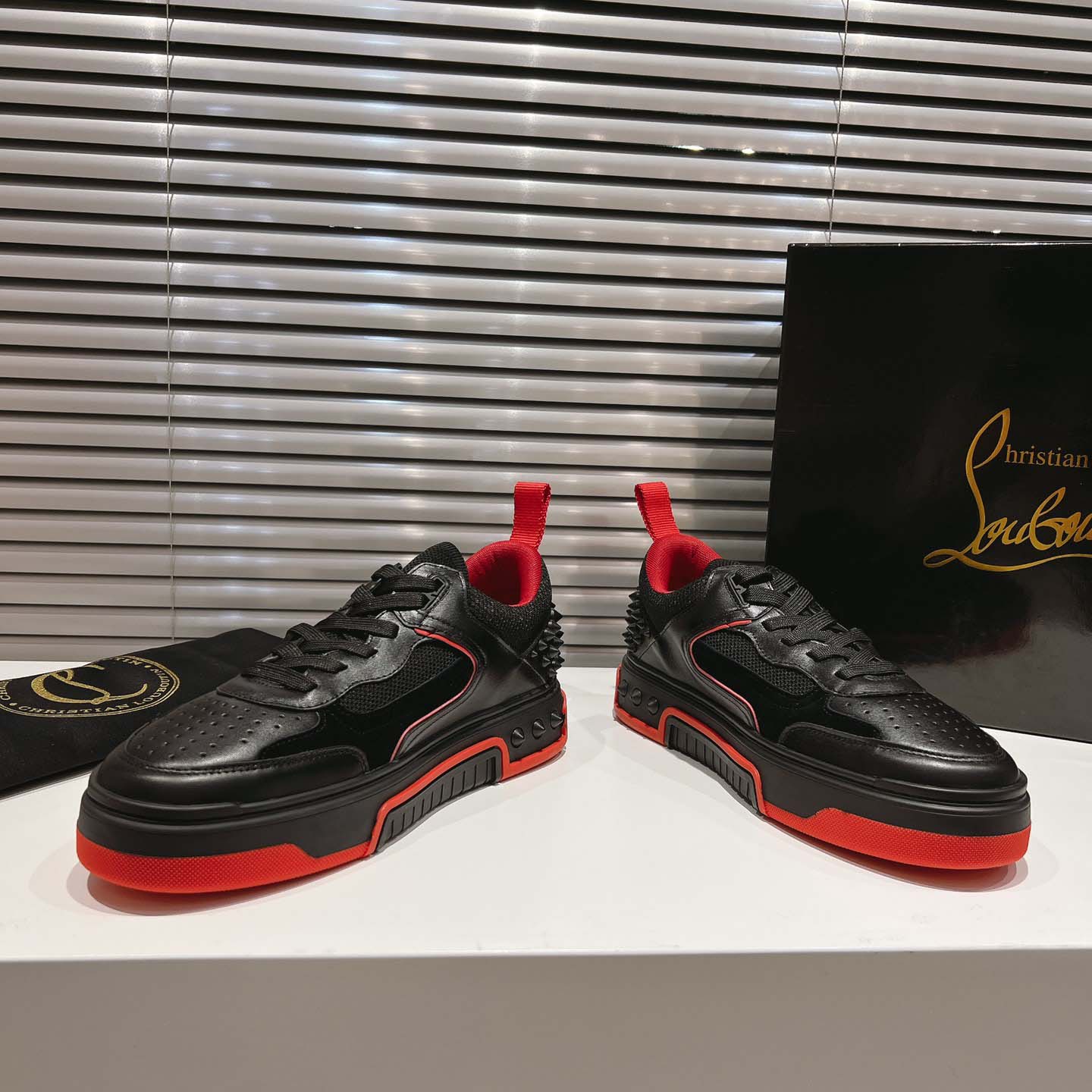 Christian Louboutin Astroloubi Leather Sneakers - FashionPlug
