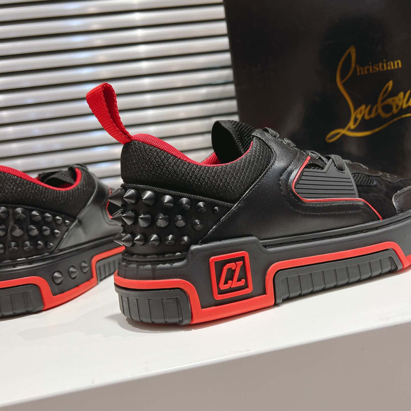 Christian Louboutin Astroloubi Leather Sneakers - FashionPlug