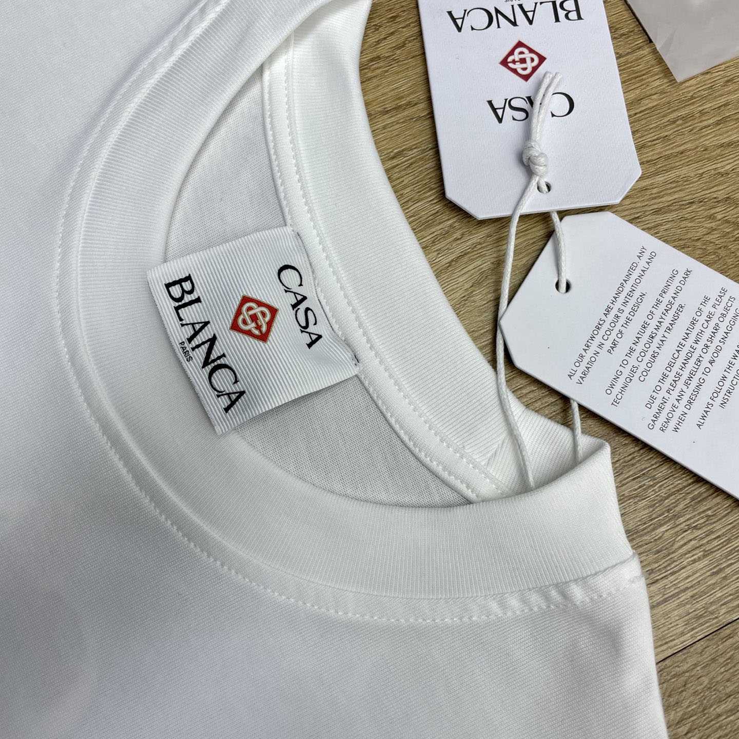 Casablanca White Innocence Triangle T-shirt Regular price C1120 - FashionPlug