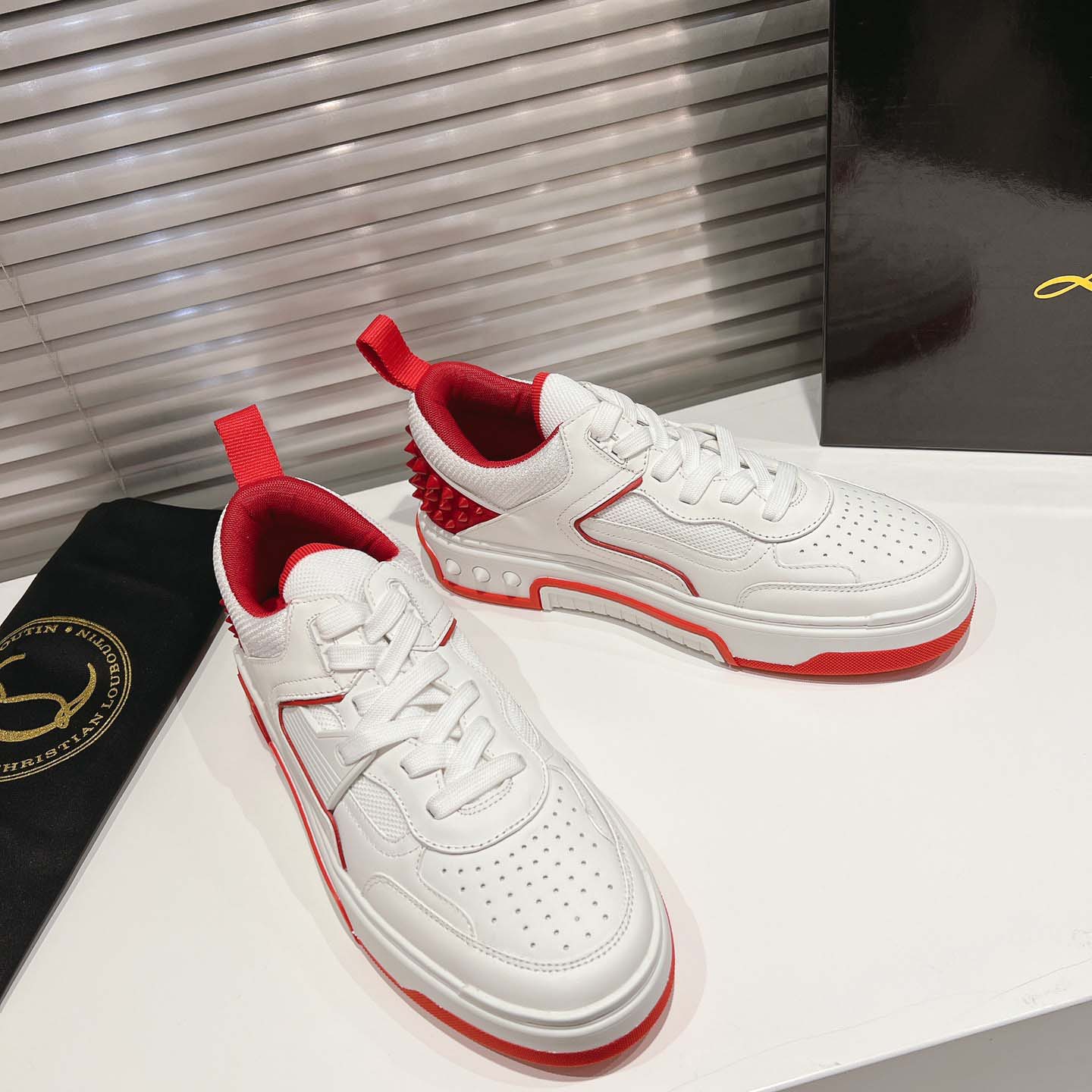 Christian Louboutin Astroloubi Leather Sneakers - FashionPlug