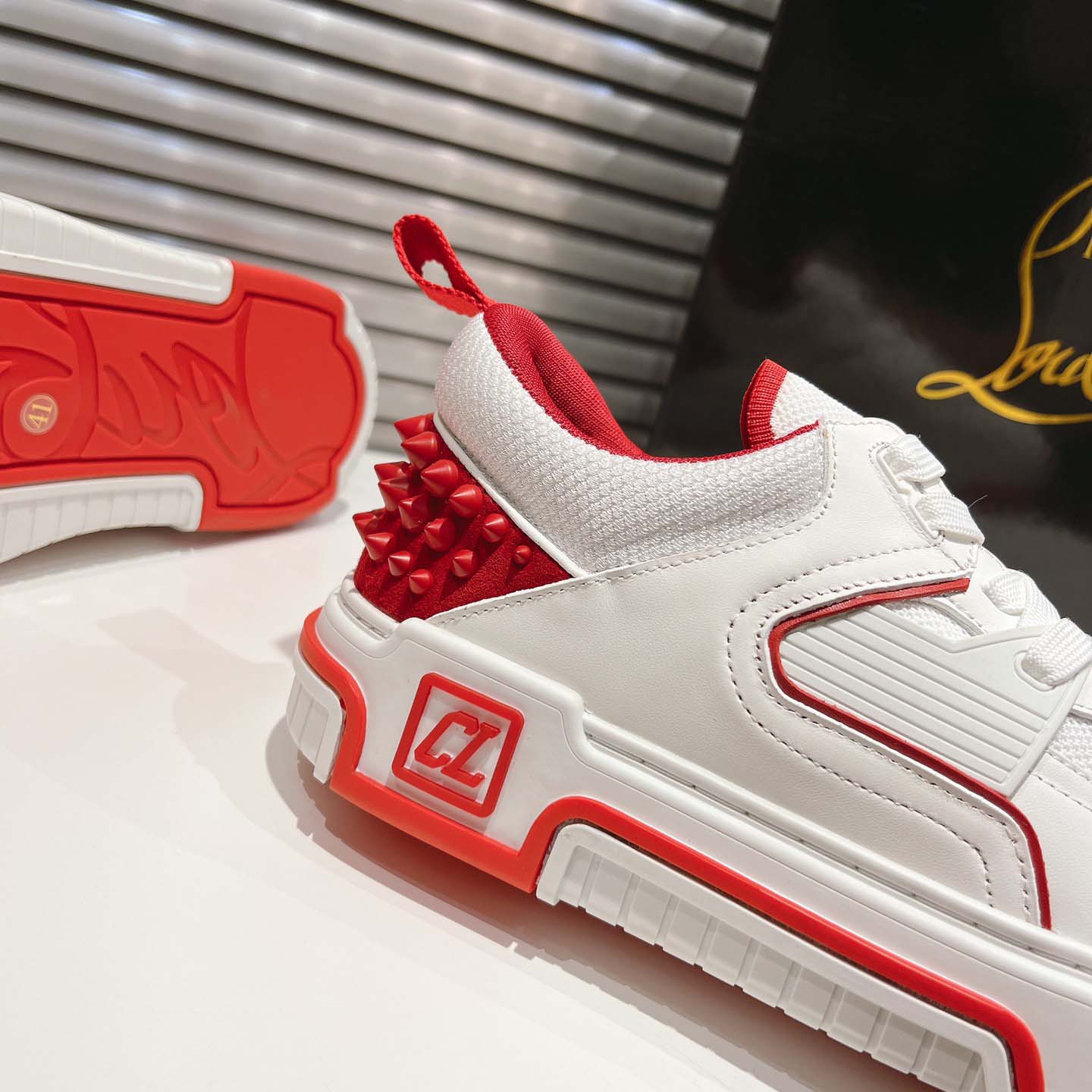 Christian Louboutin Astroloubi Leather Sneakers - FashionPlug