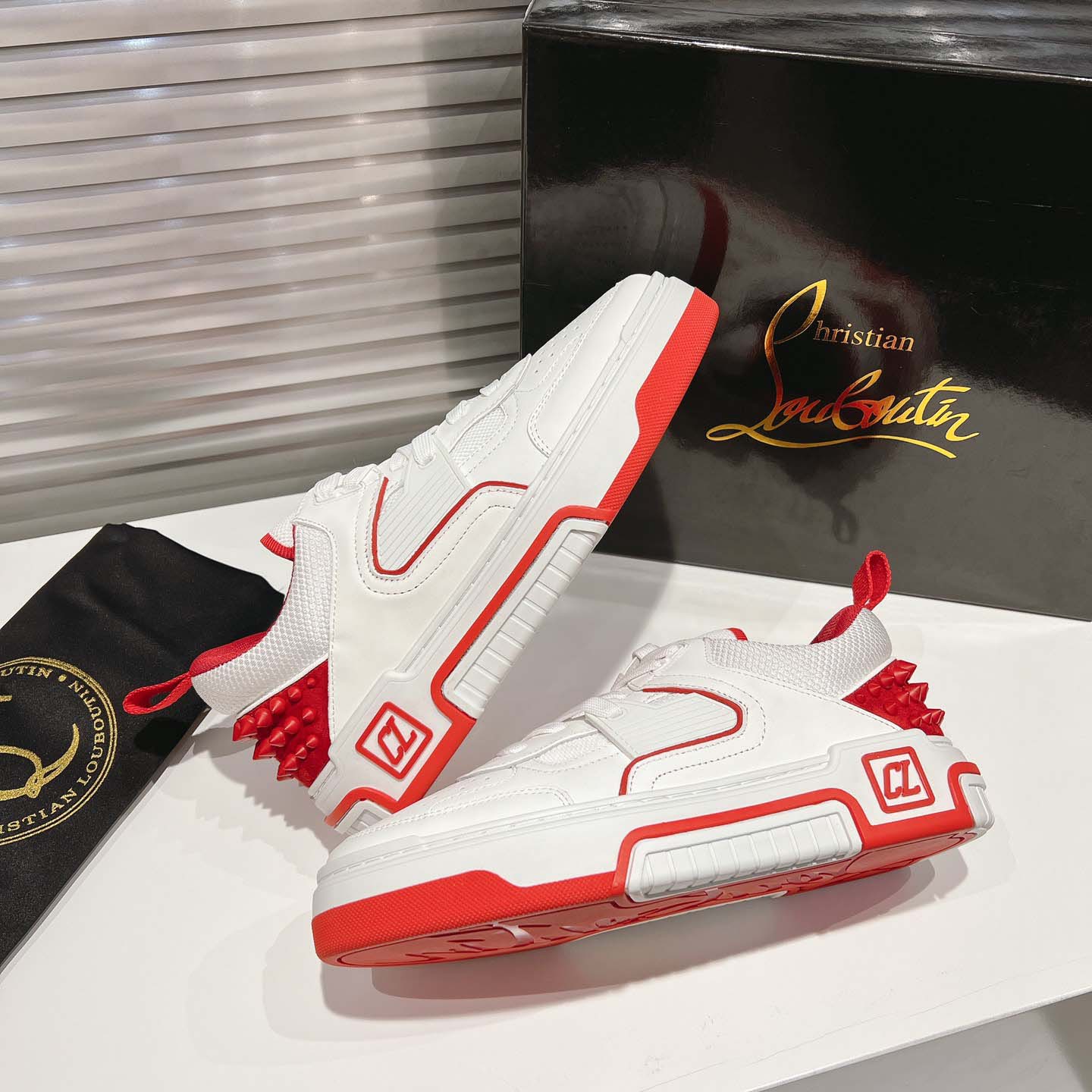 Christian Louboutin Astroloubi Leather Sneakers - FashionPlug