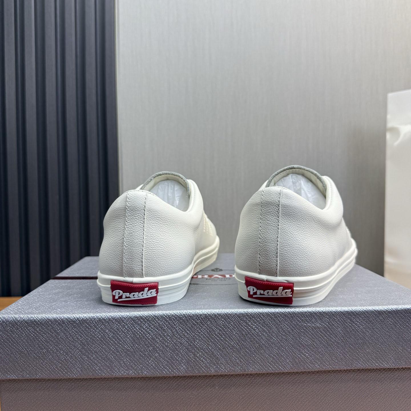 Prada Distressed Leather Sneakers - FashionPlug