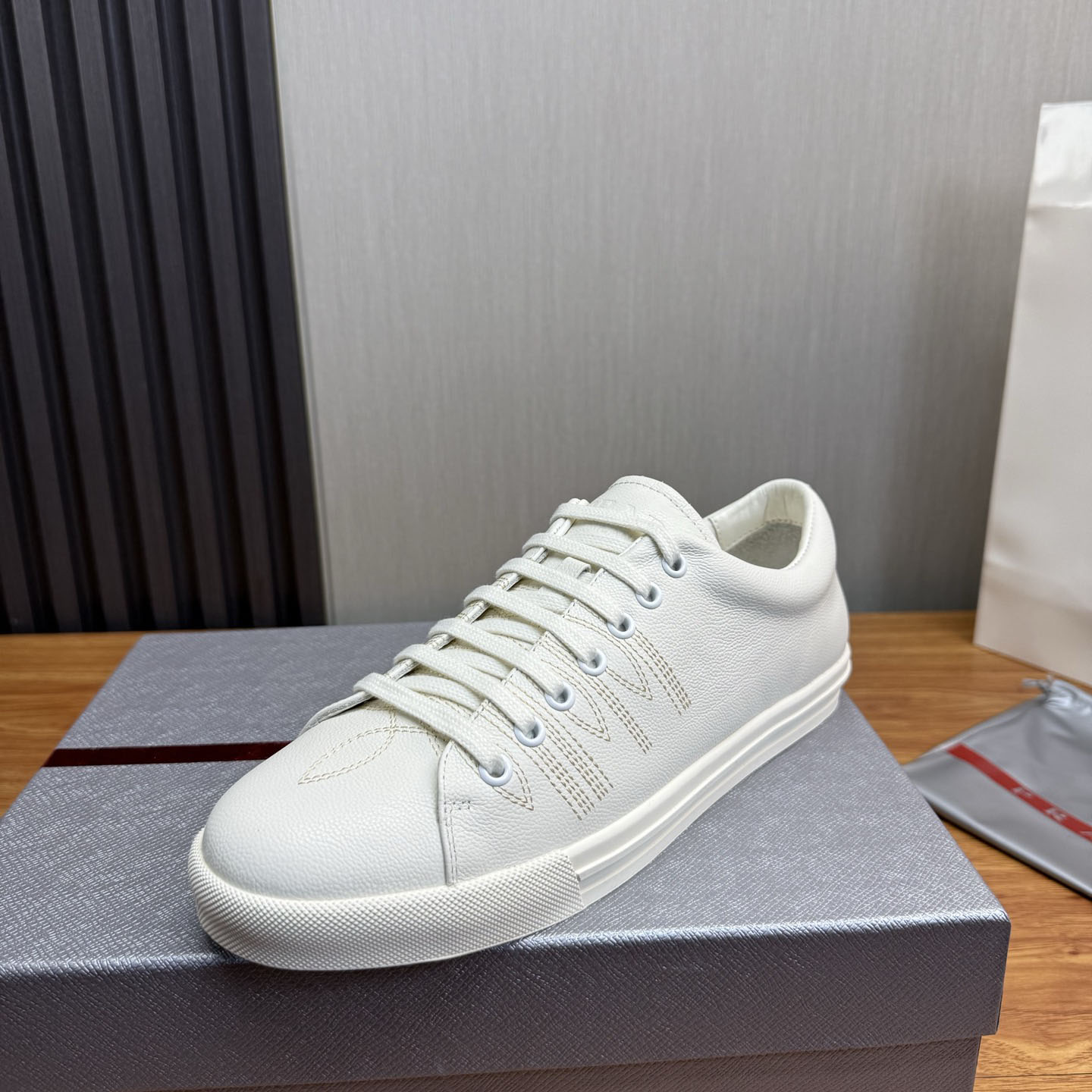 Prada Distressed Leather Sneakers - FashionPlug
