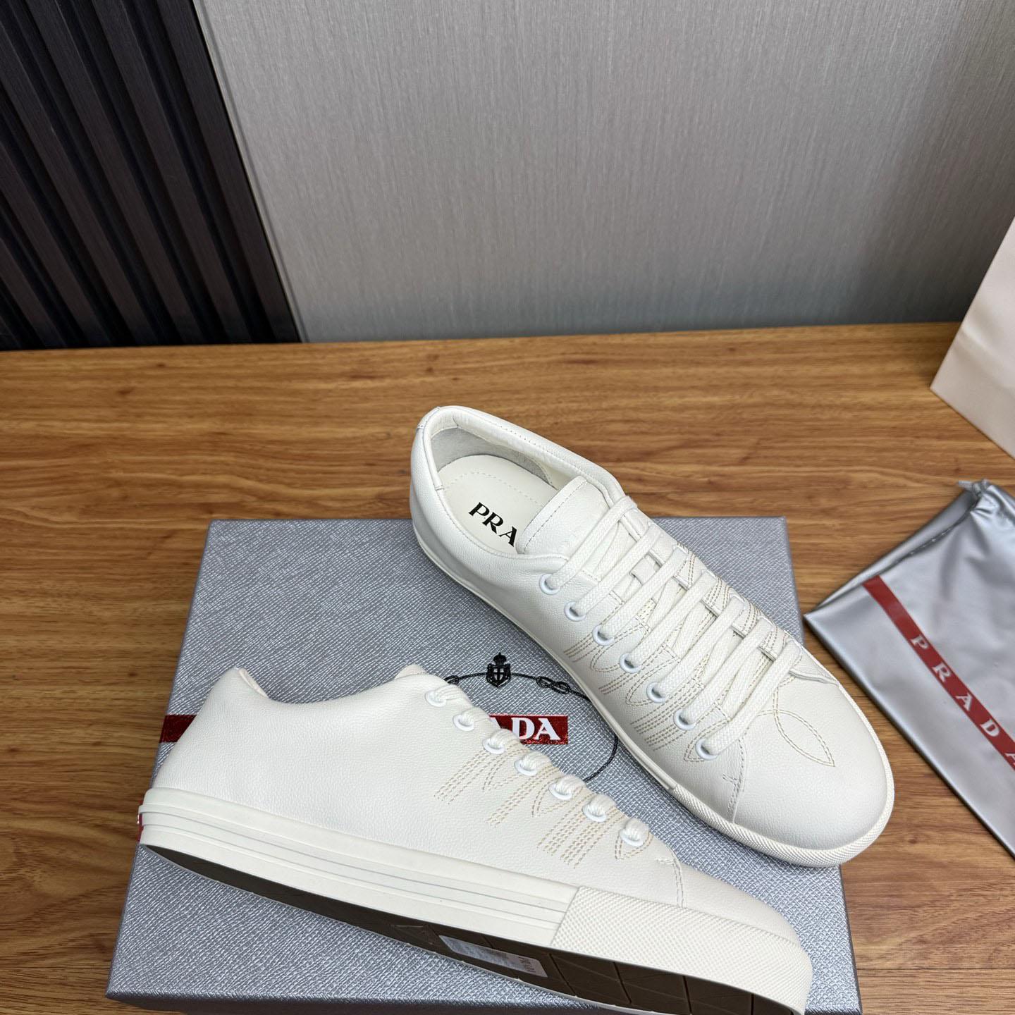 Prada Distressed Leather Sneakers - FashionPlug