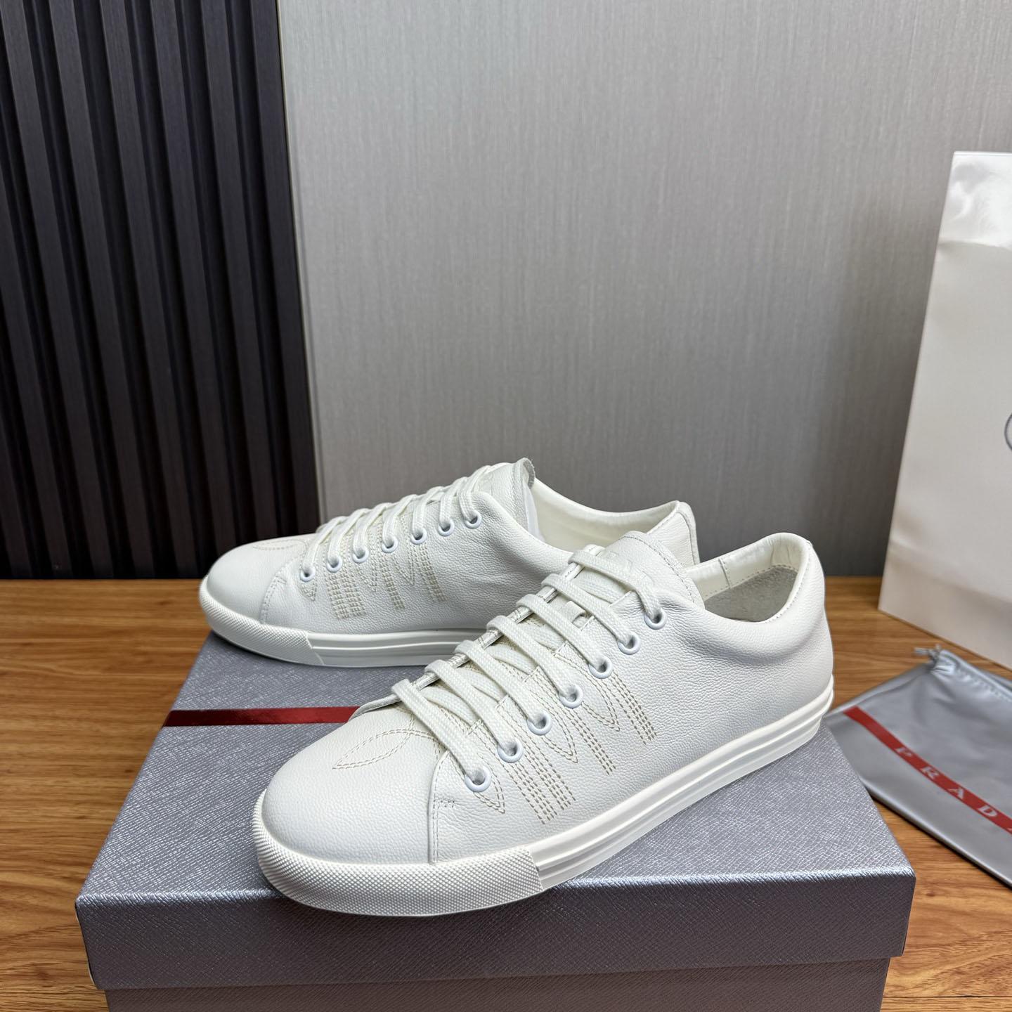 Prada Distressed Leather Sneakers - FashionPlug