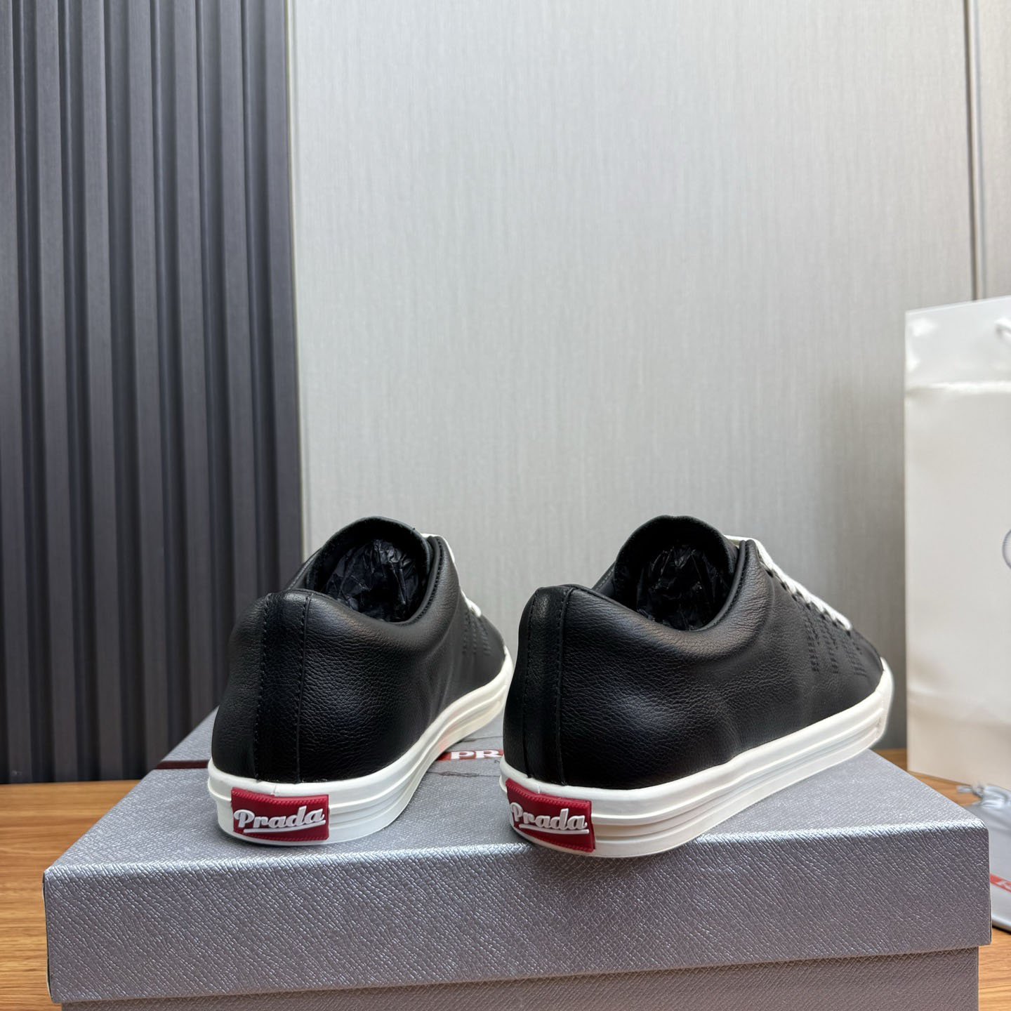 Prada Aged-Effect Lace-Up Low-Top Sneakers - FashionPlug