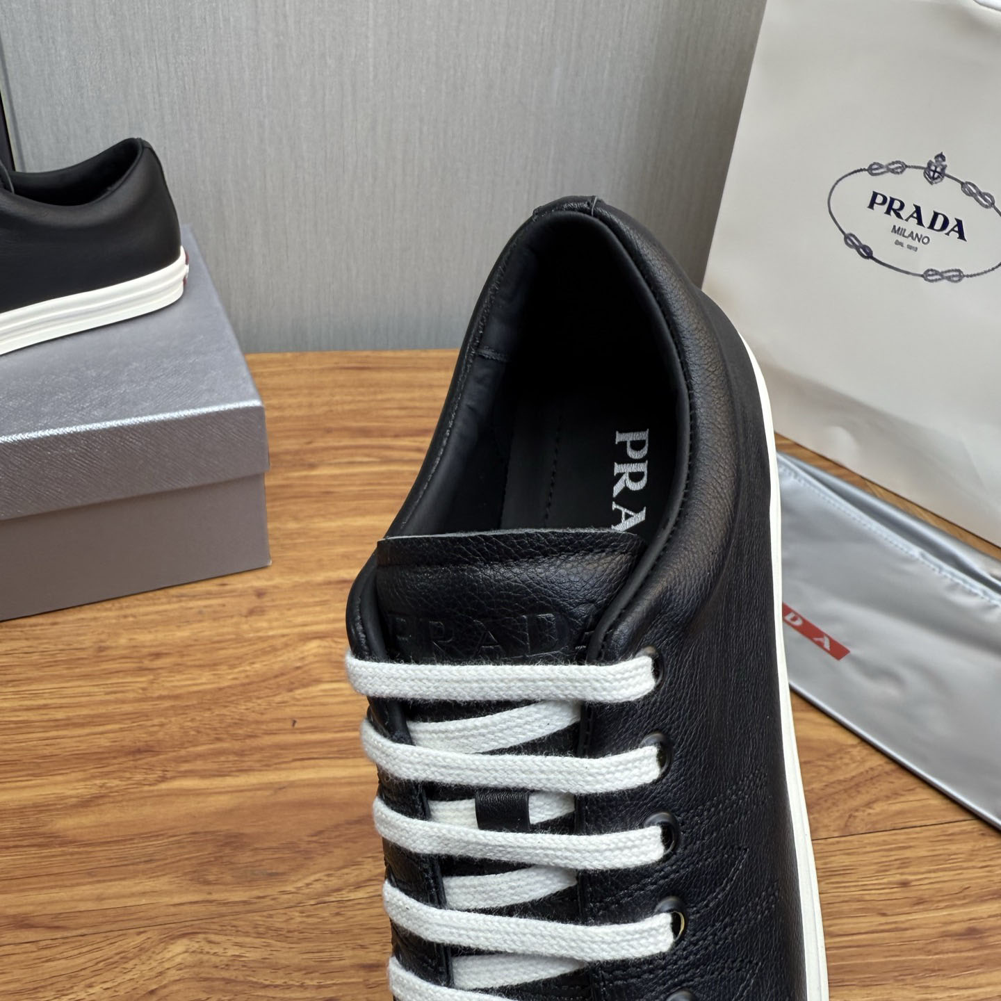 Prada Aged-Effect Lace-Up Low-Top Sneakers - FashionPlug