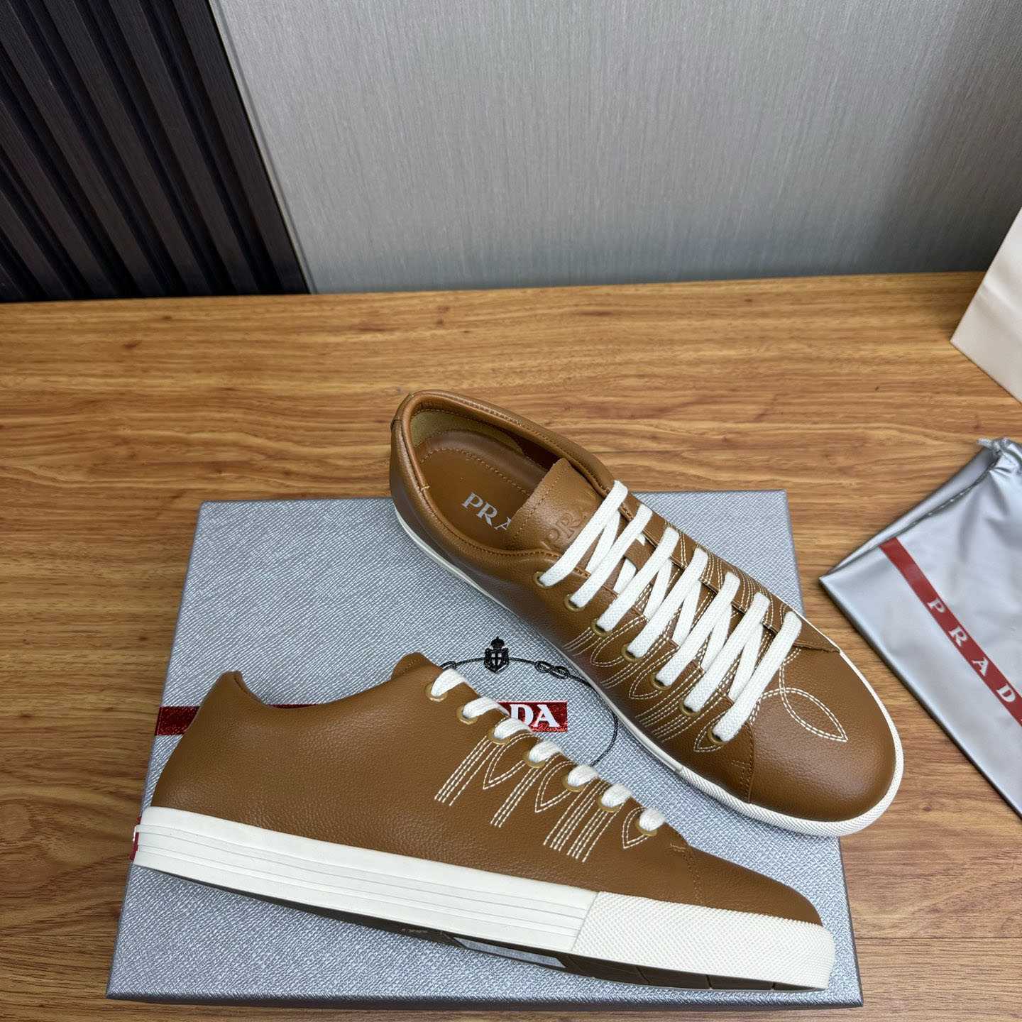 Prada Decorative-Stitching Leather Low-Top Sneakers - FashionPlug