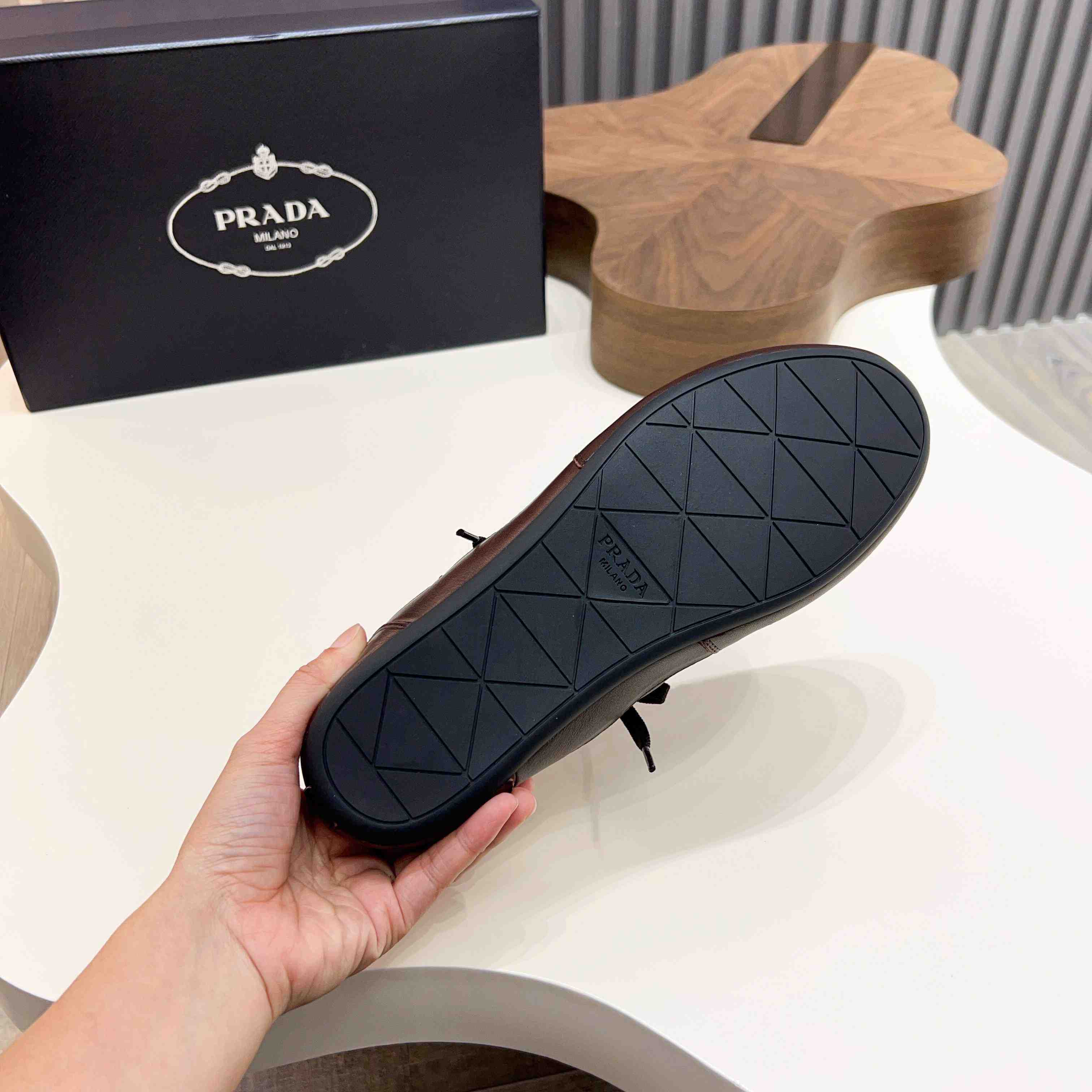 Prada Collapse Leather Sneakers - FashionPlug