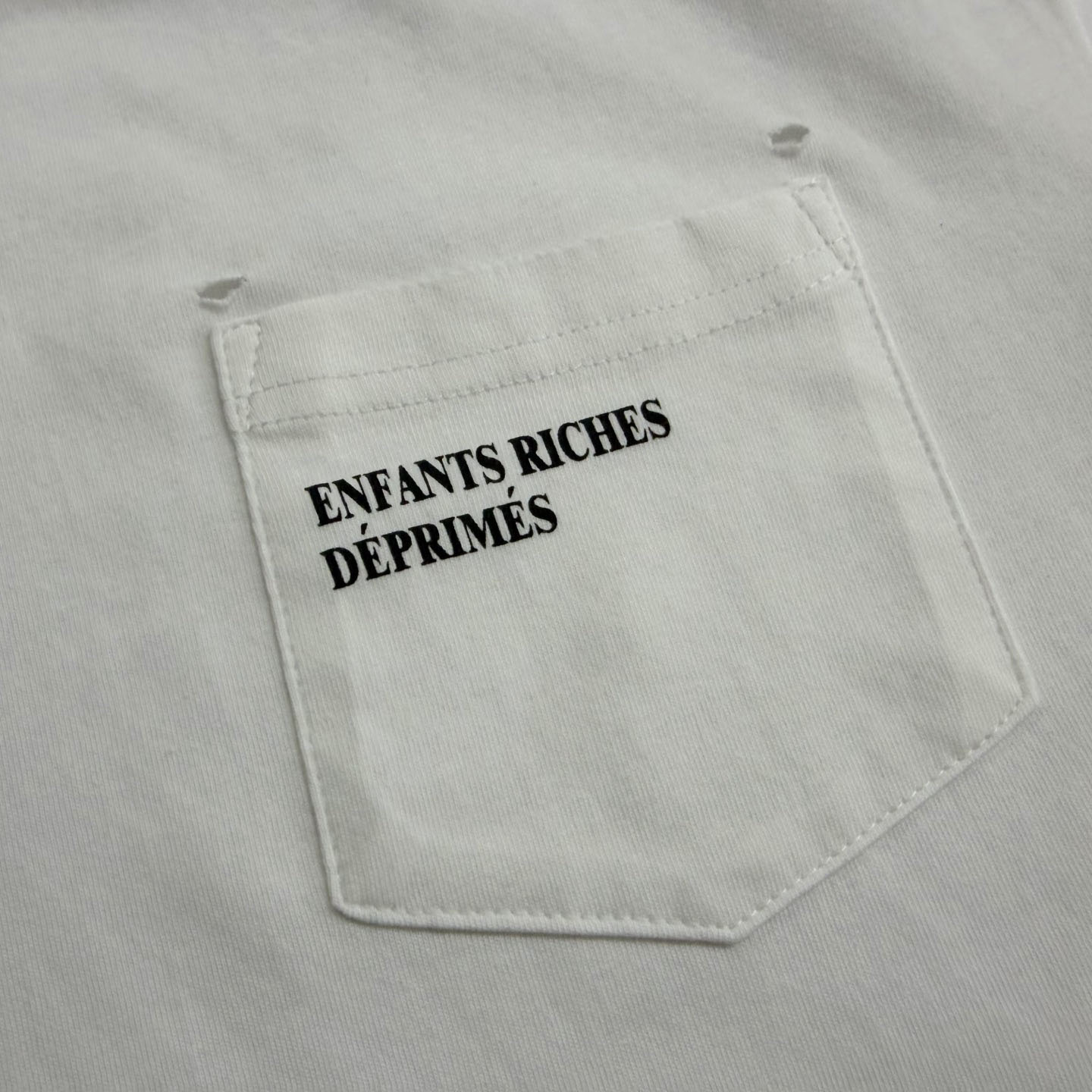 Enfants Riches Déprimés  Distressed Logo-Print Cotton-Jersey T-Shirt - White - FashionPlug