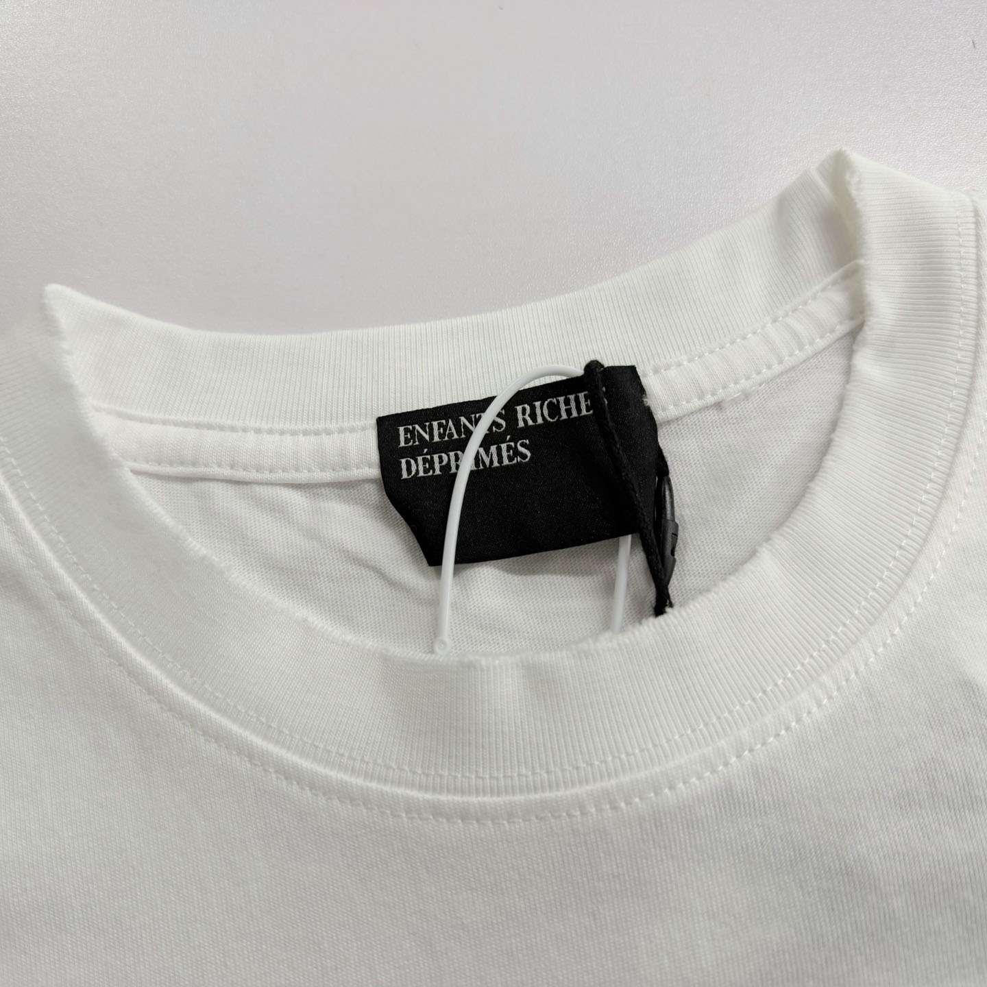 Enfants Riches Déprimés  Distressed Logo-Print Cotton-Jersey T-Shirt - White - FashionPlug