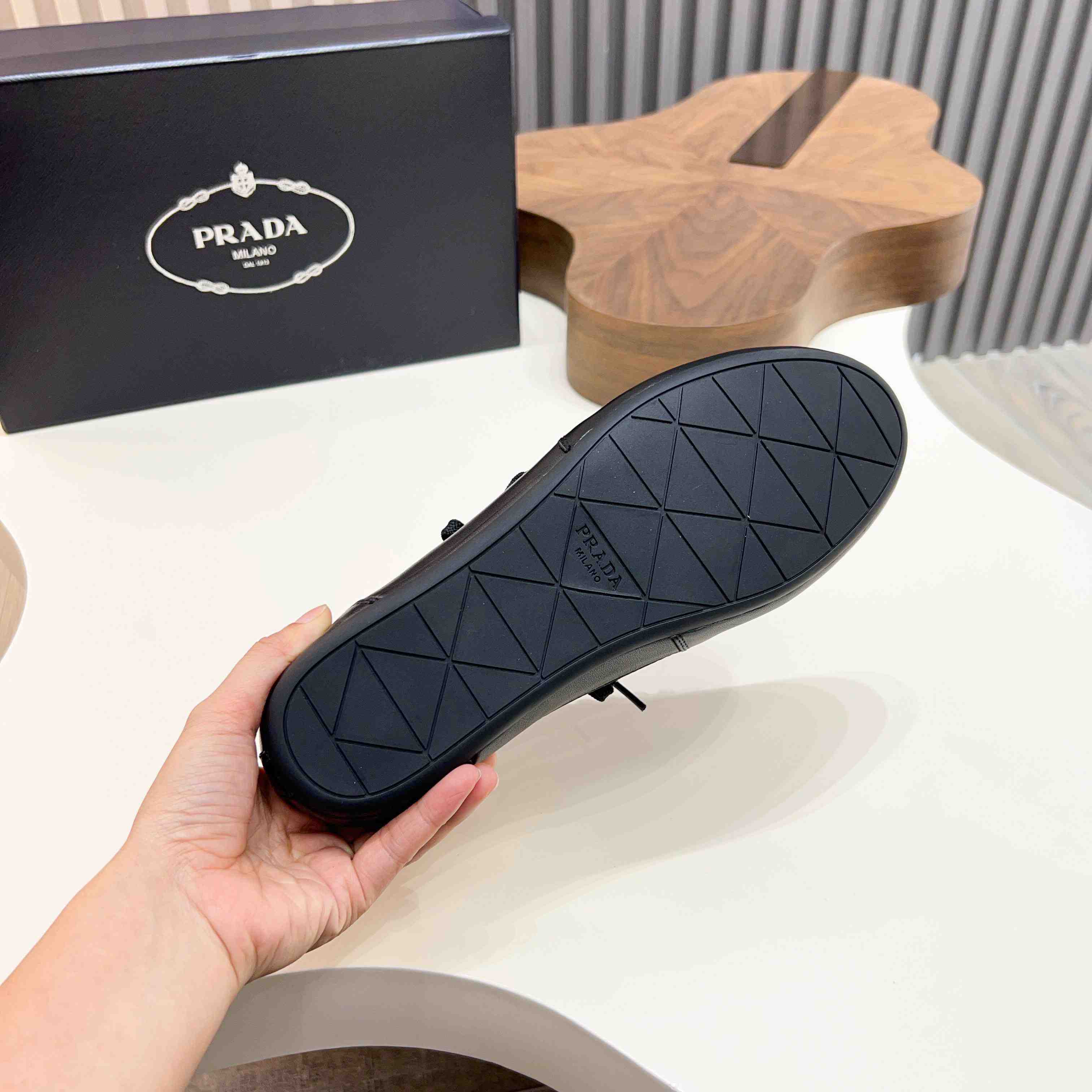 Prada Collapse Leather Sneakers - FashionPlug