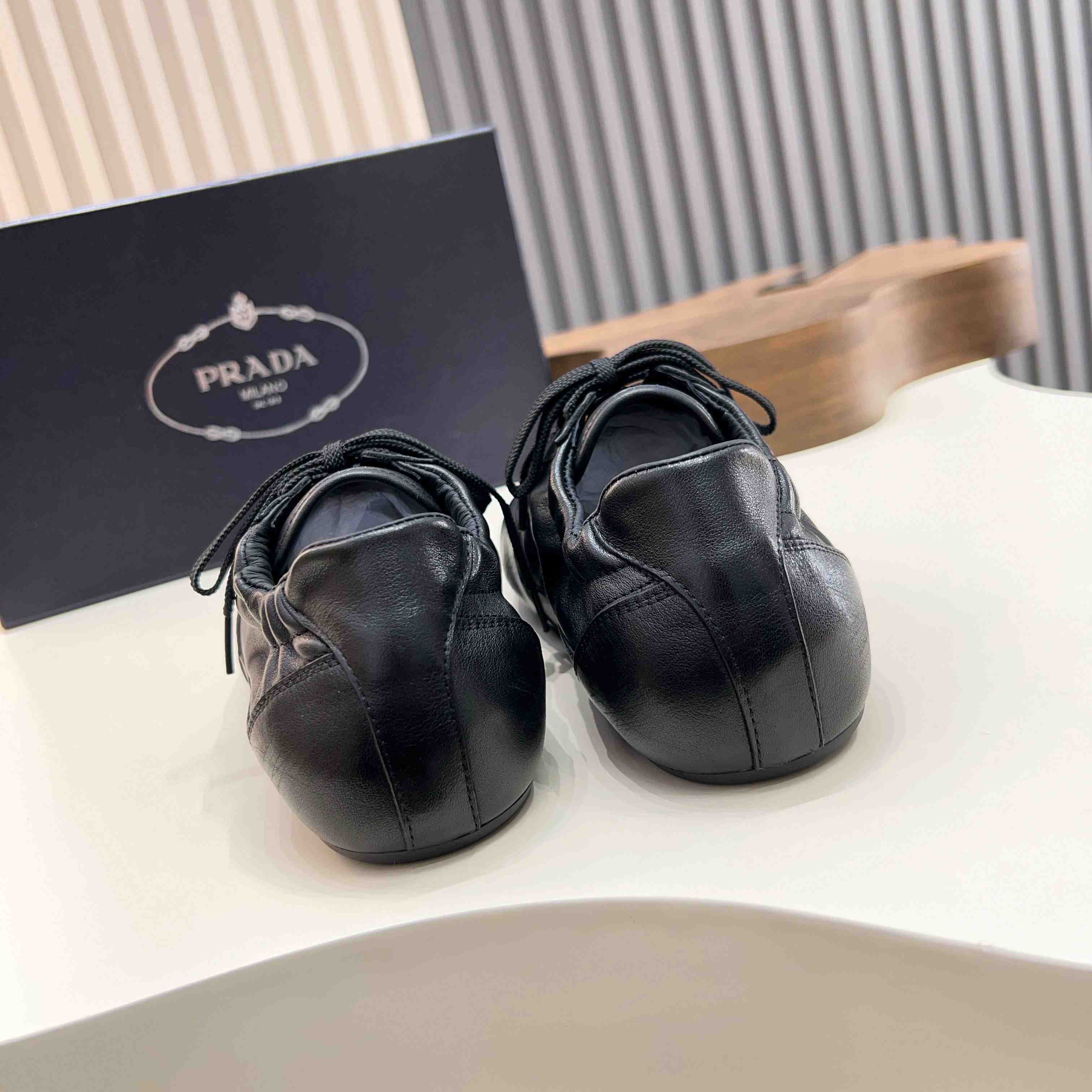 Prada Collapse Leather Sneakers - FashionPlug