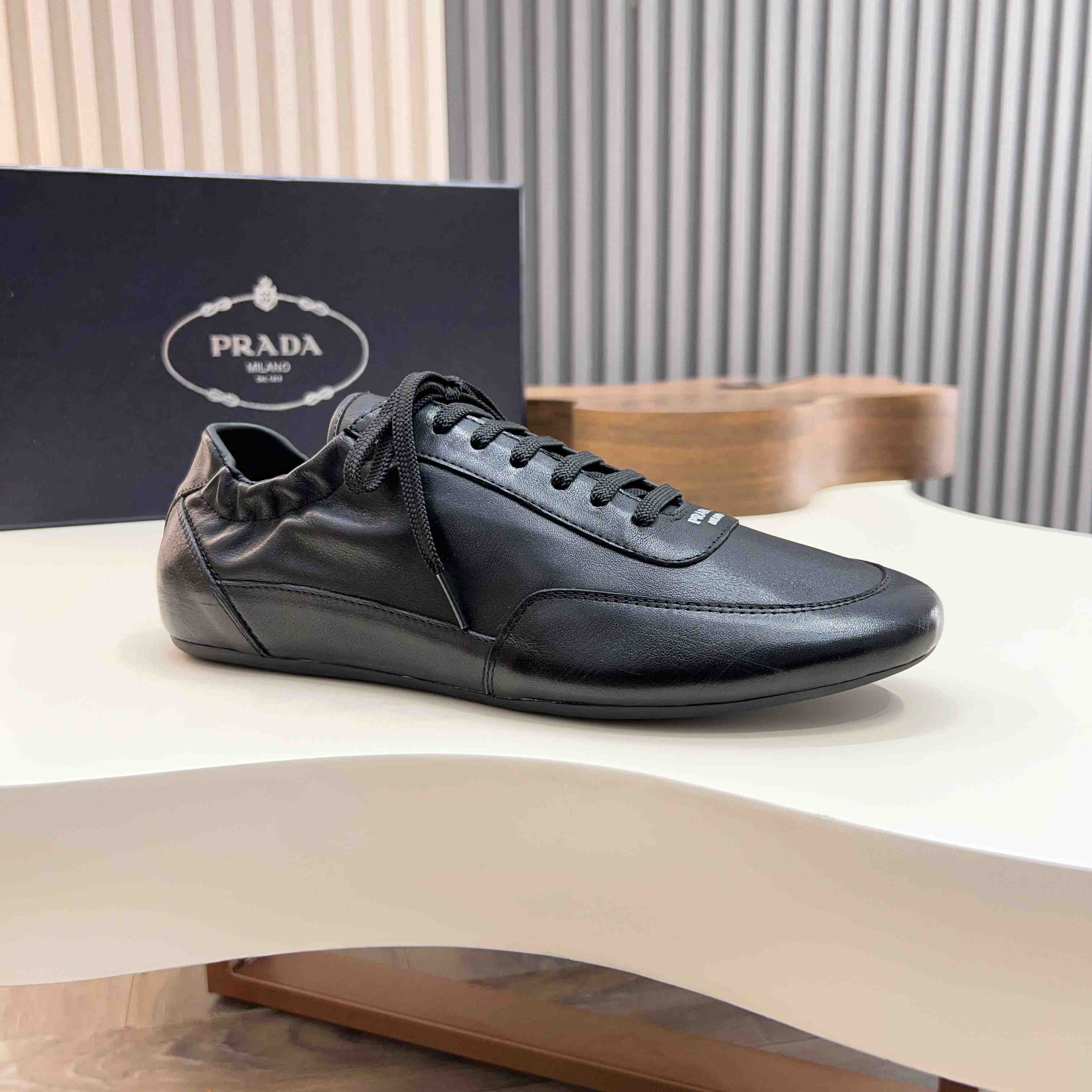 Prada Collapse Leather Sneakers - FashionPlug