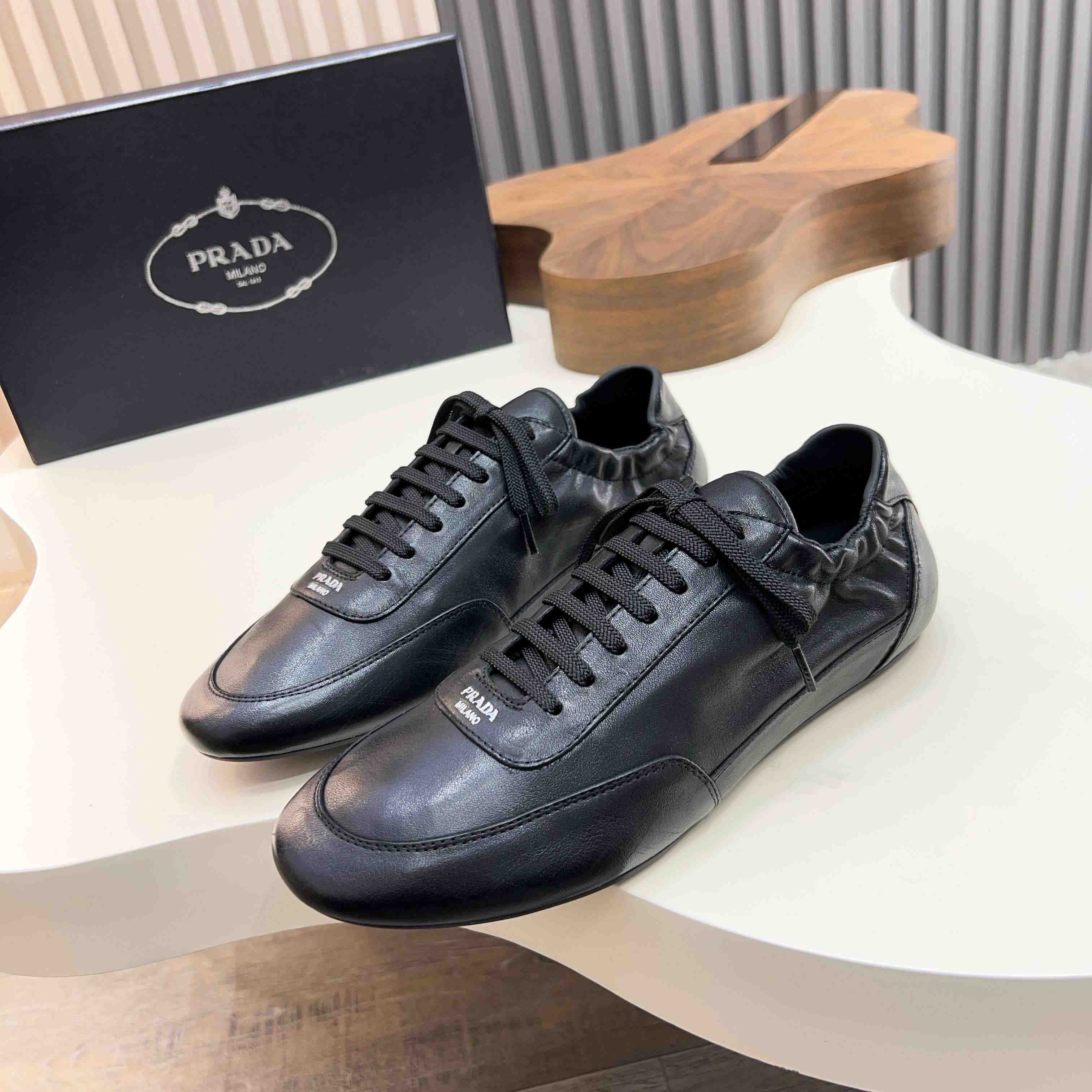 Prada Collapse Leather Sneakers - FashionPlug