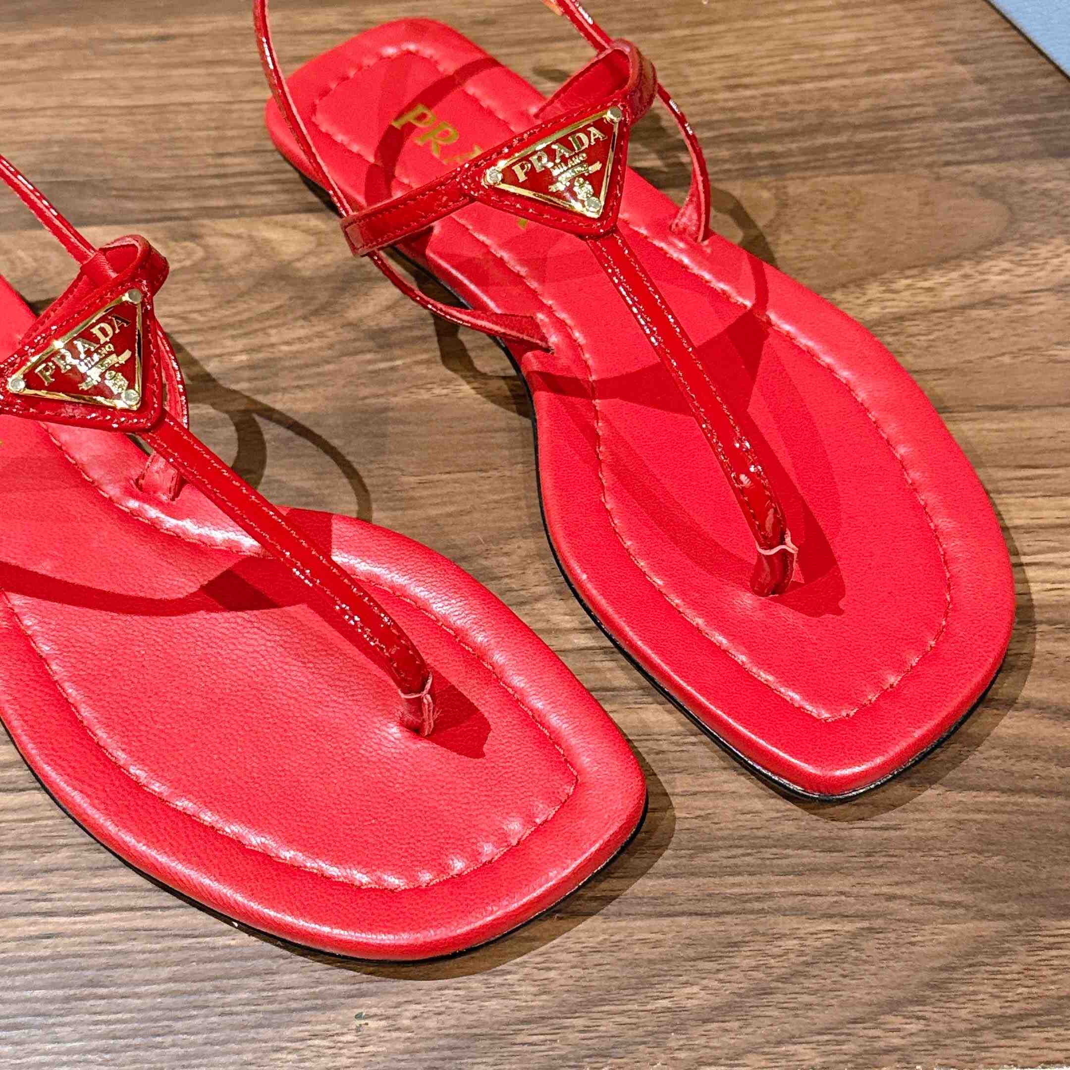 Prada Patent Leather Thong Sandals - FashionPlug