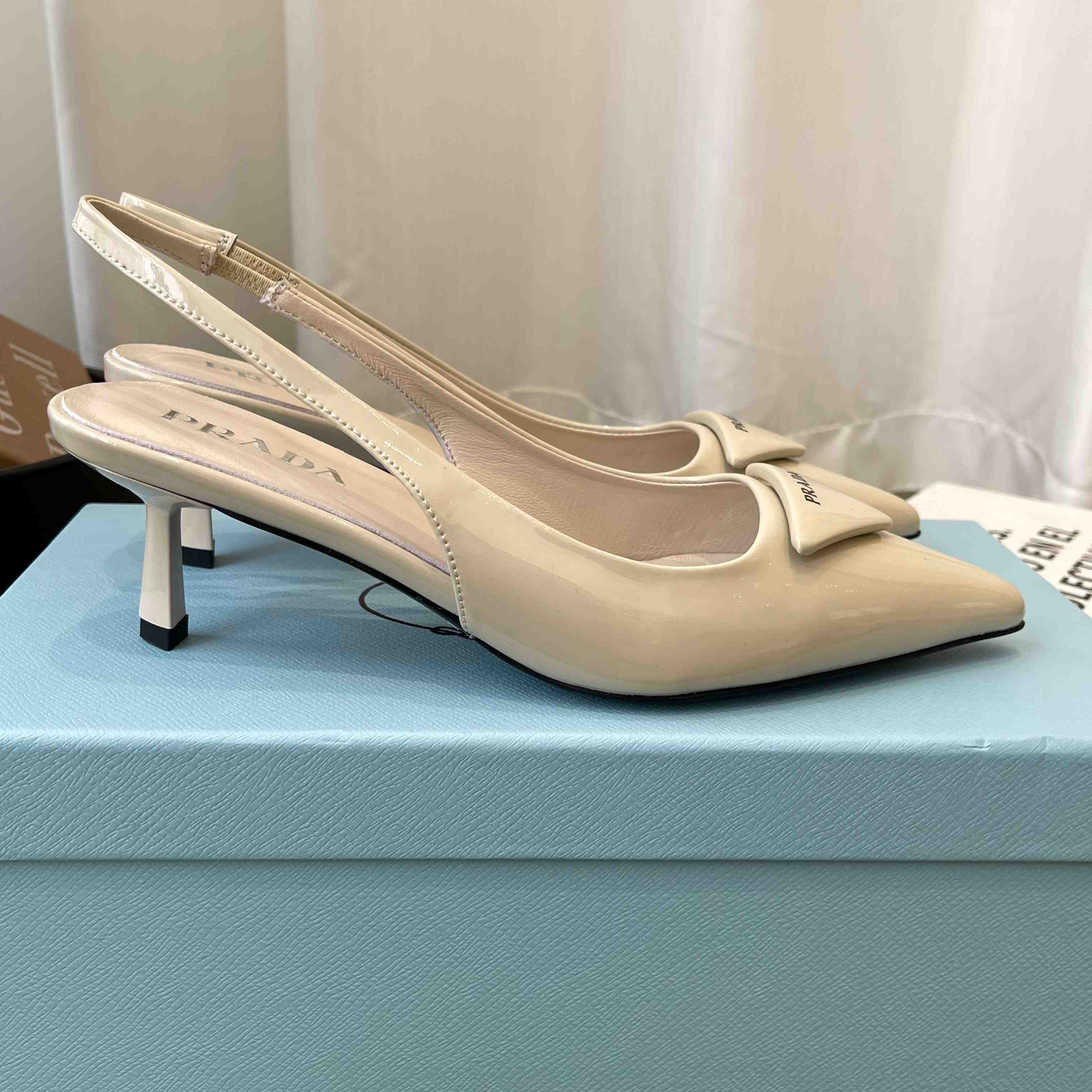 Prada Patent Leather Slingback Pumps - FashionPlug